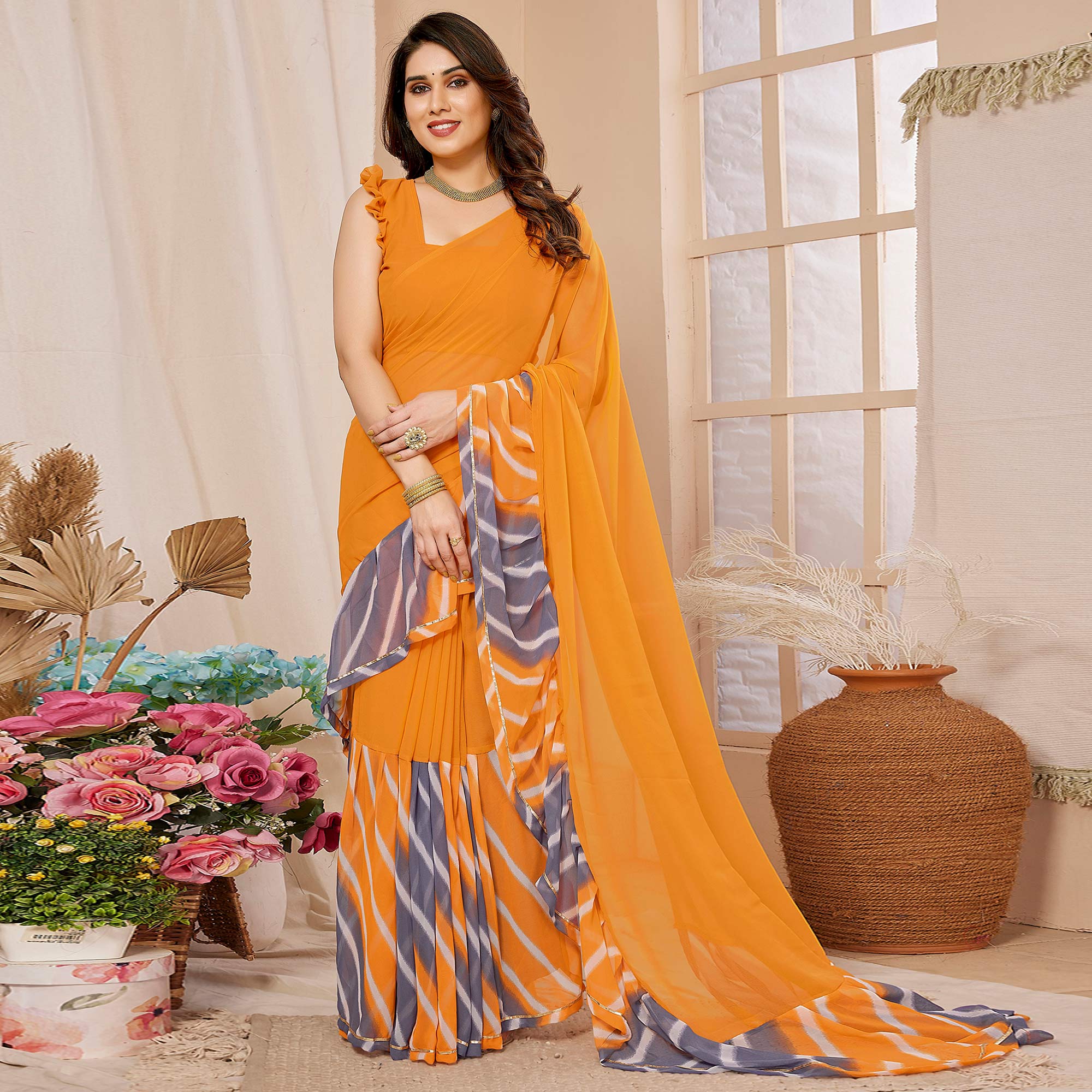 Orange Solid Georgette Saree With Printed Ruffle Border