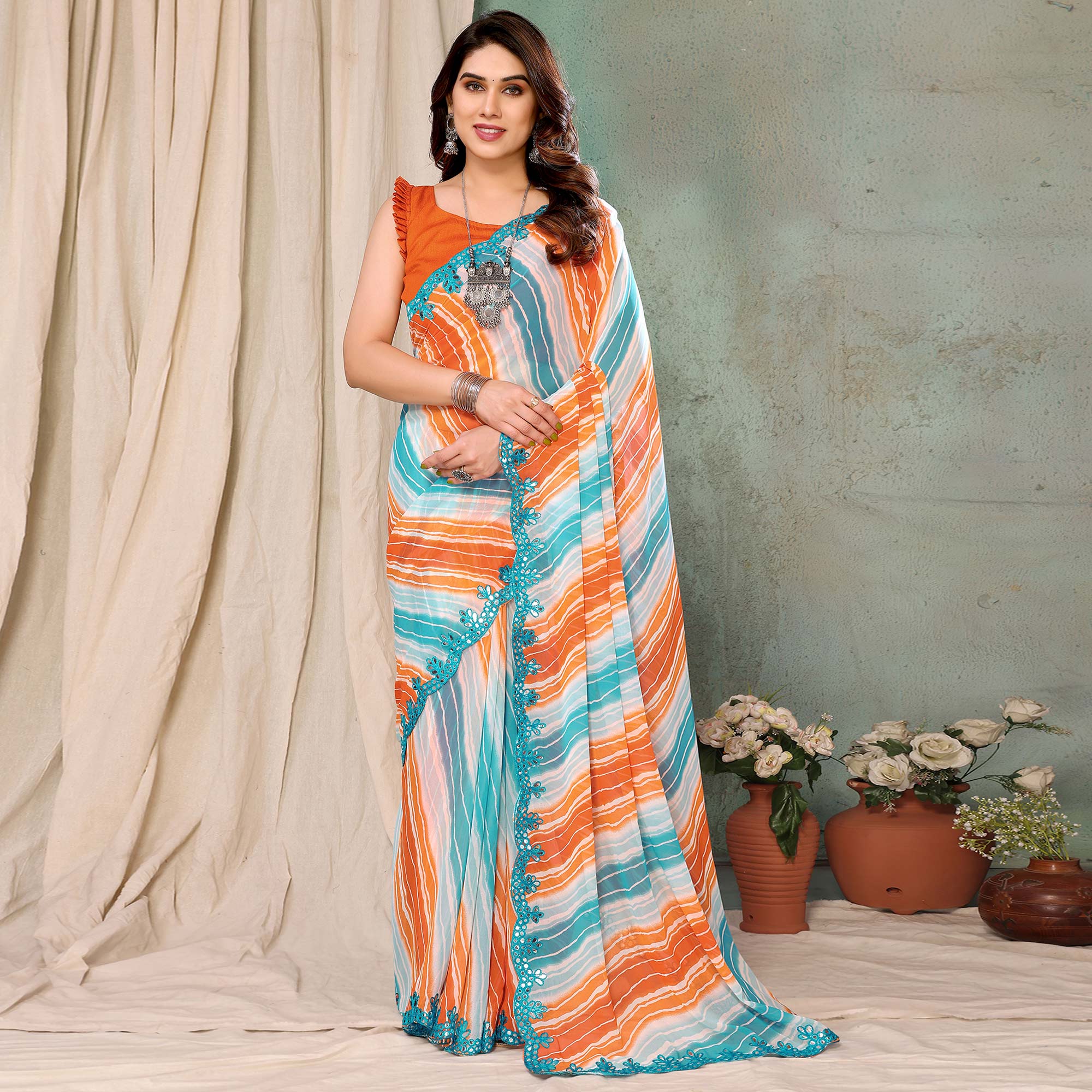 Orange & Sky Blue Printed Georgette Saree With Mirror Work Border