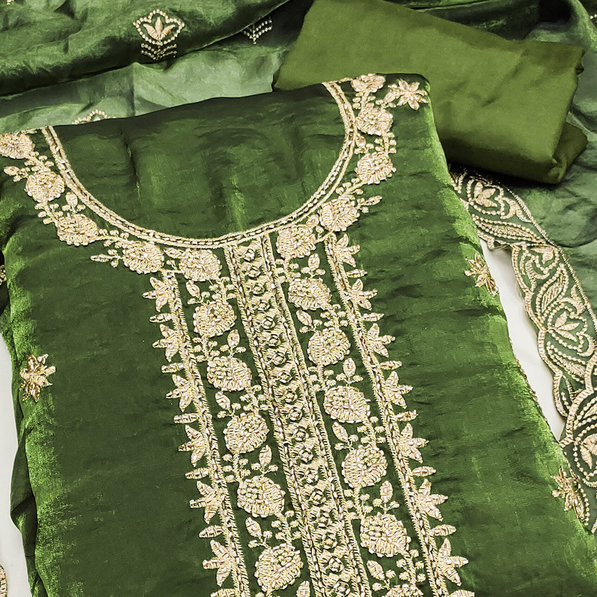 Green Satin Dress Material Featuring Exquisite Floral Embroidery With Detailed Handwork Accents