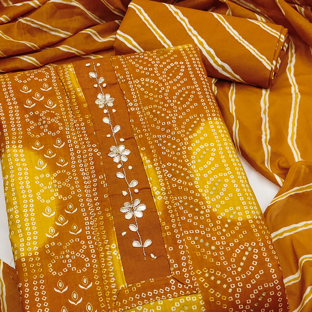 Mustard Pure Cotton Dress Material Adorned with Bandhani Print & Artistic Floral Handwork Detailing