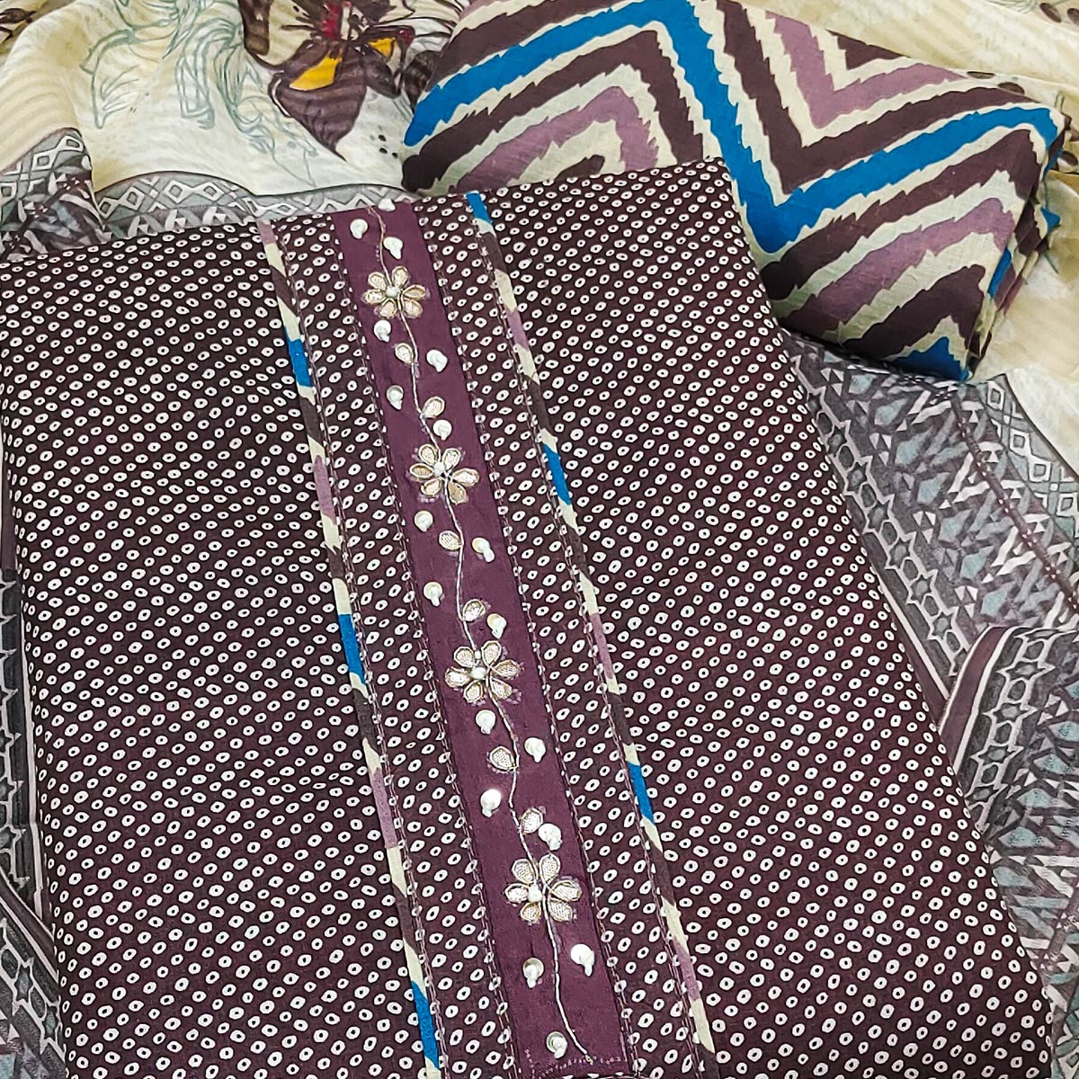 Elegant Wine Bandhani Printed Pure Cotton Dress Material Enhanced With Delicate Floral Handwork