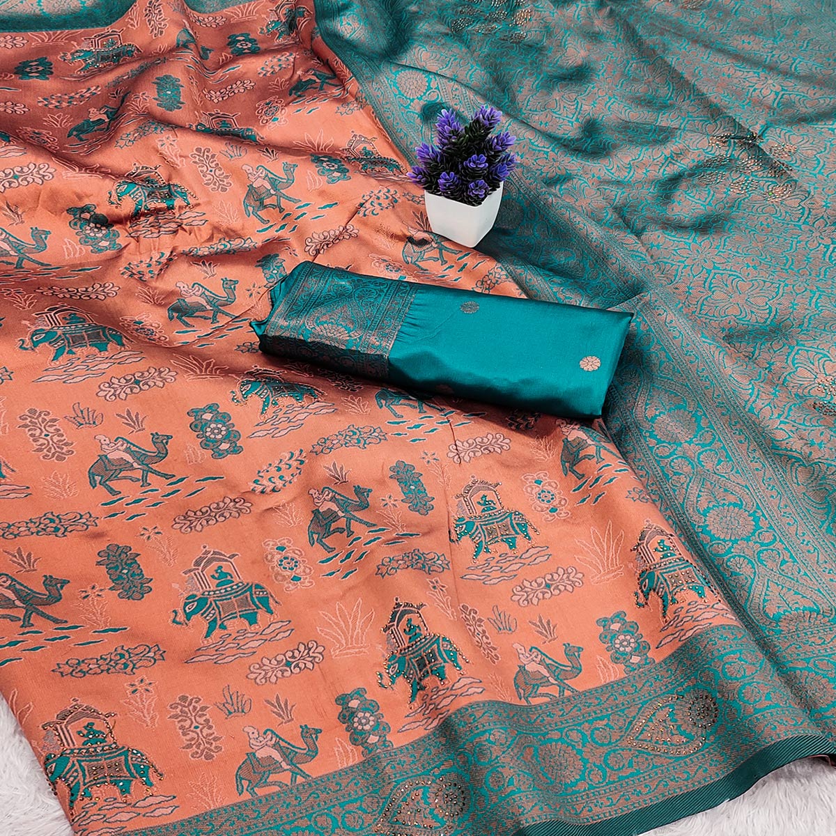 Peach & Teal Lightweight Tissue Silk Saree Highlighted with Artistic Weaving and Swarovski Sparkle