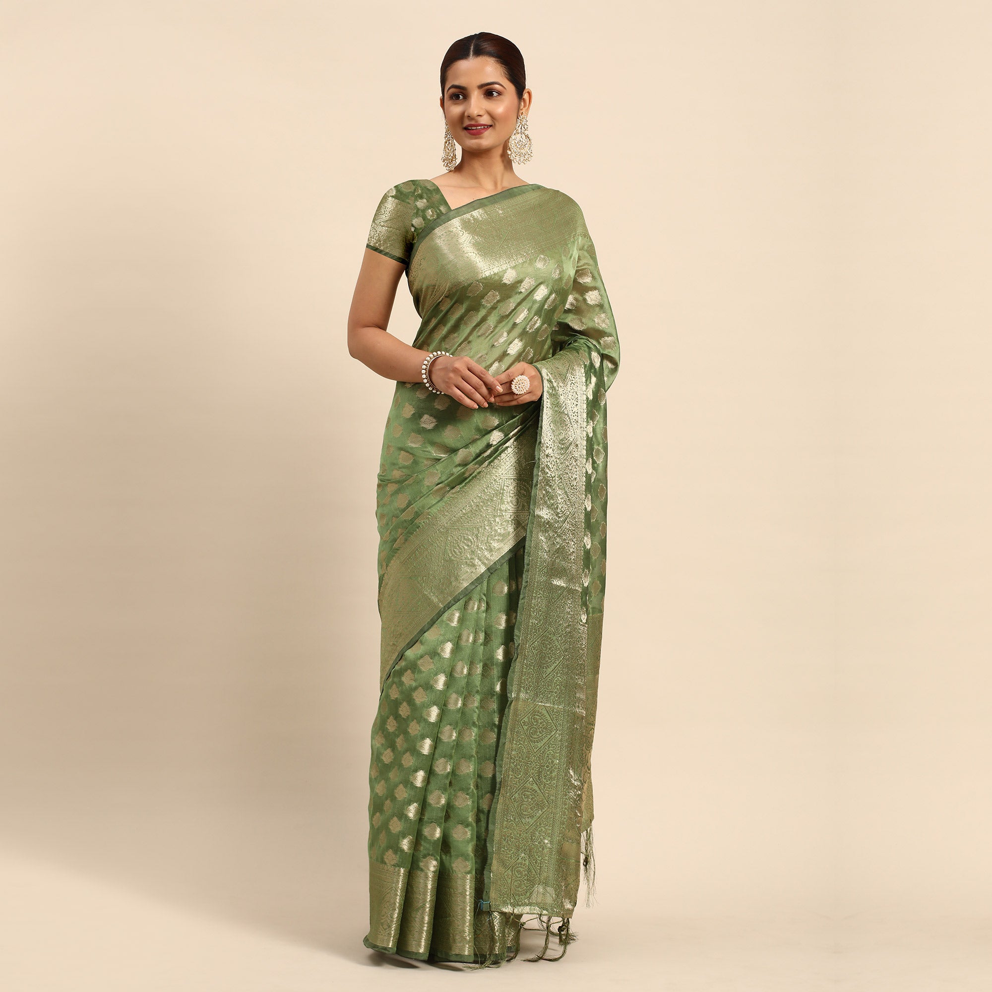 Green Woven Organza Silk Saree With Tassels