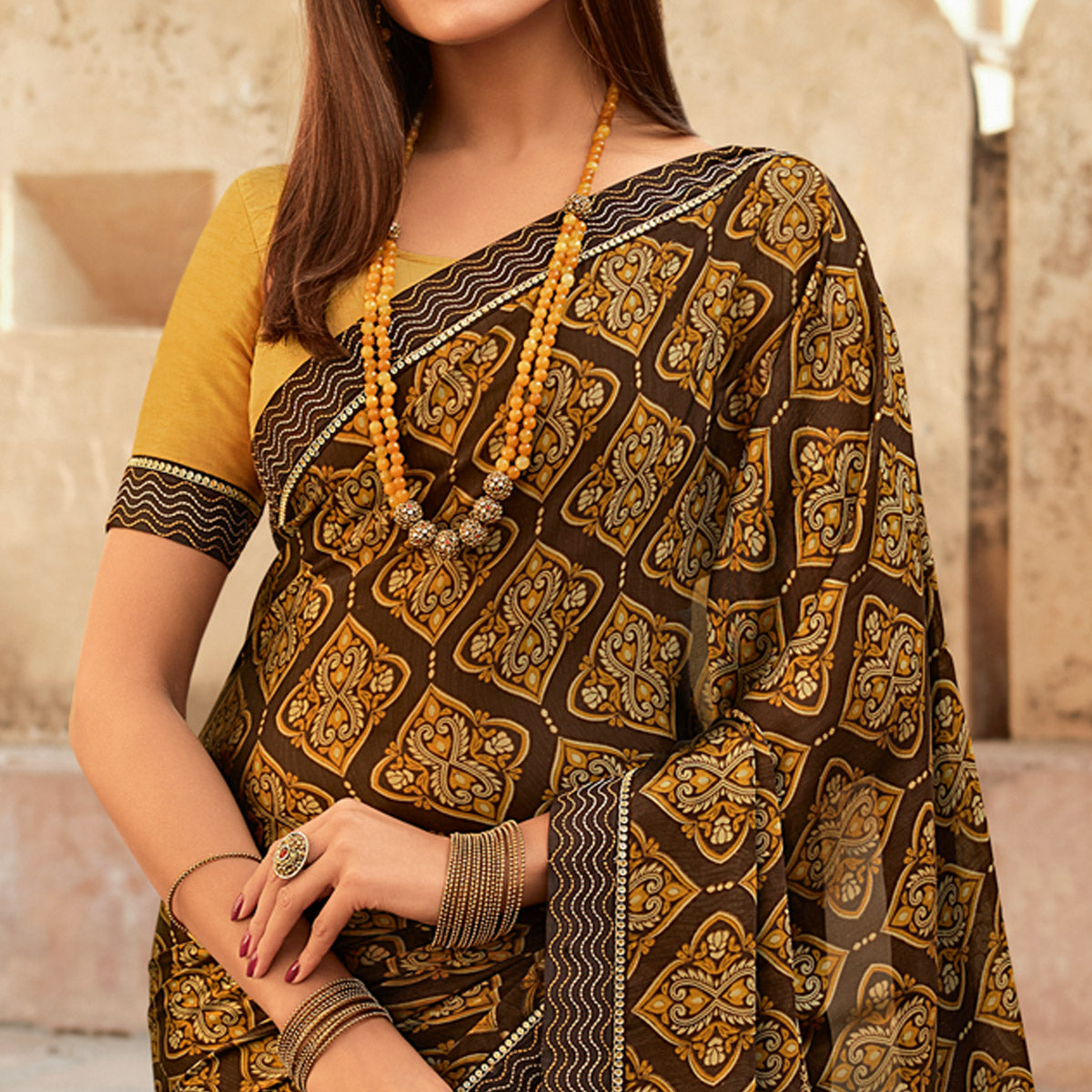 Brown Printed With Embroidered Border Georgette Saree
