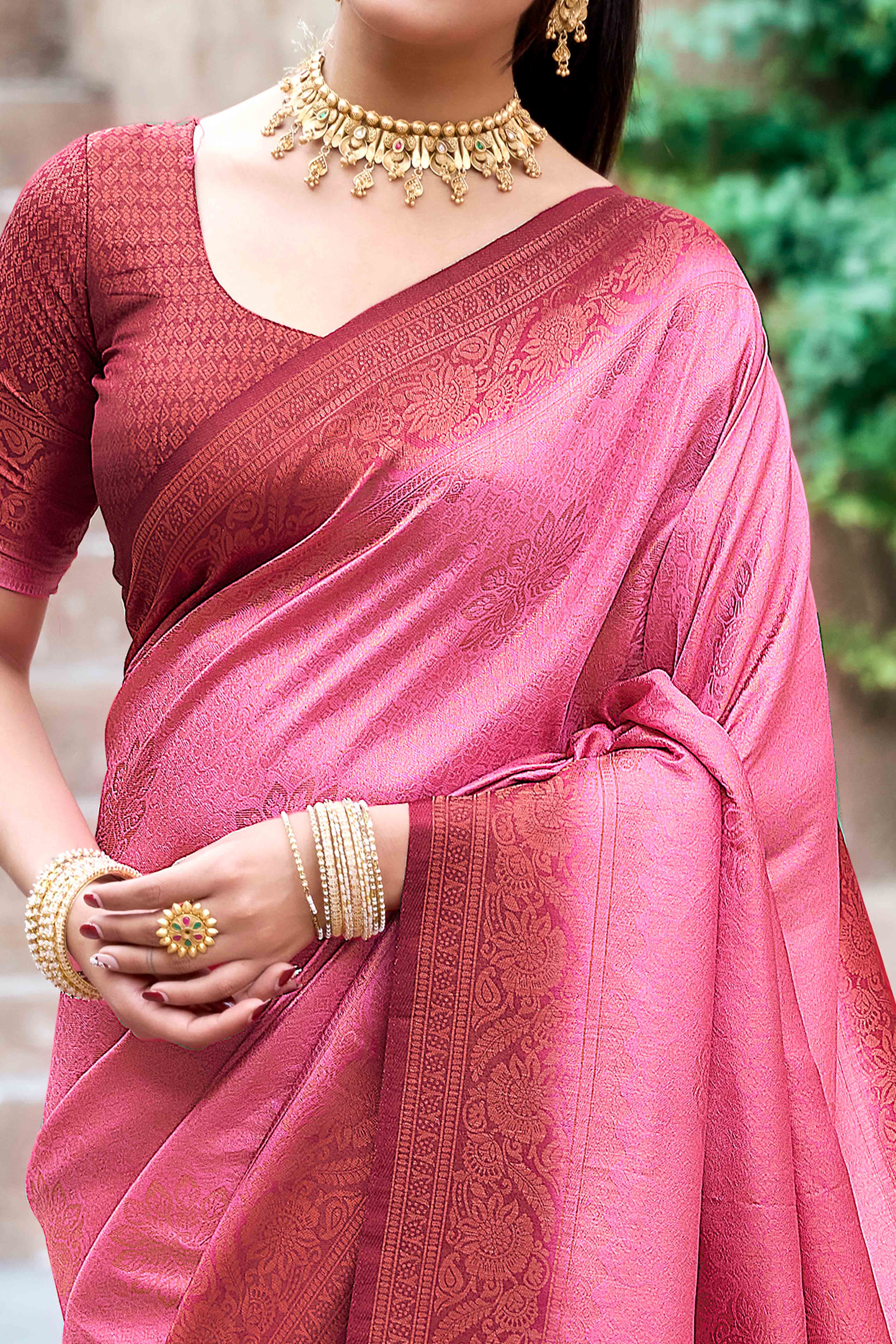 Gajari Pink Banarasi Silk Saree Featuring Elegant Floral Woven & Delicate Tassel Edging