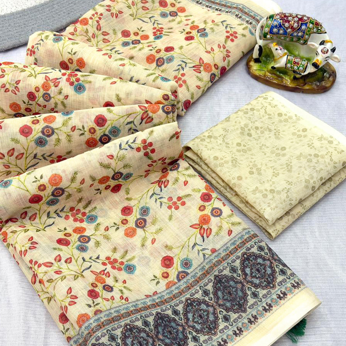 Luxurious Cream Floral Printed Linen Cotton Saree with Decorative Fancy Latkan Pallu