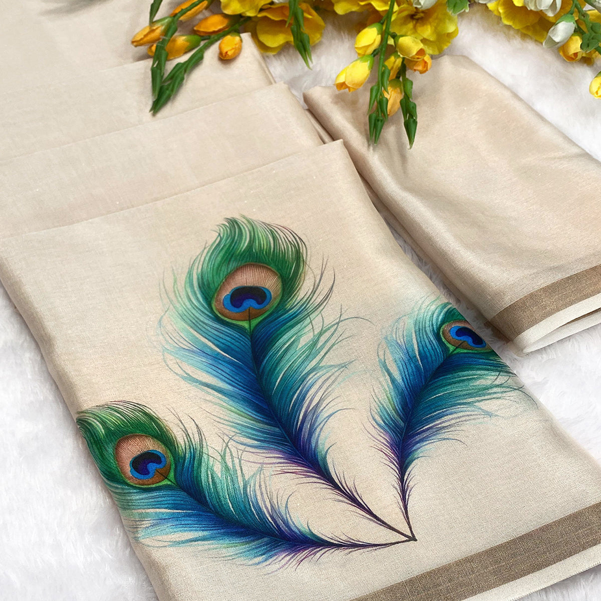 Charming Cream Soft Tussar Cotton Silk Saree With Peacock Feathers Print