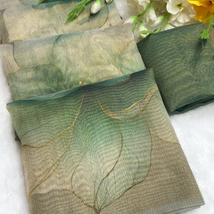 Sophisticated Dusty Green Floral Digital Print Tissue Saree Enhanced With Handmade Tassels