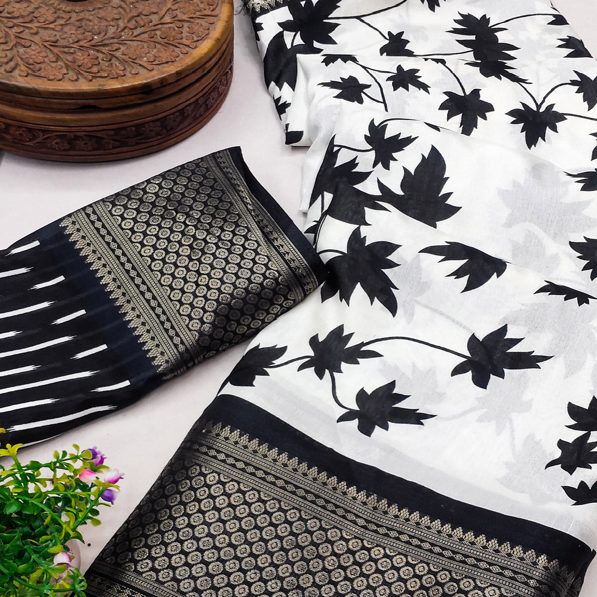 Off White & Black Floral Printed Dola Silk Saree With Zari Border