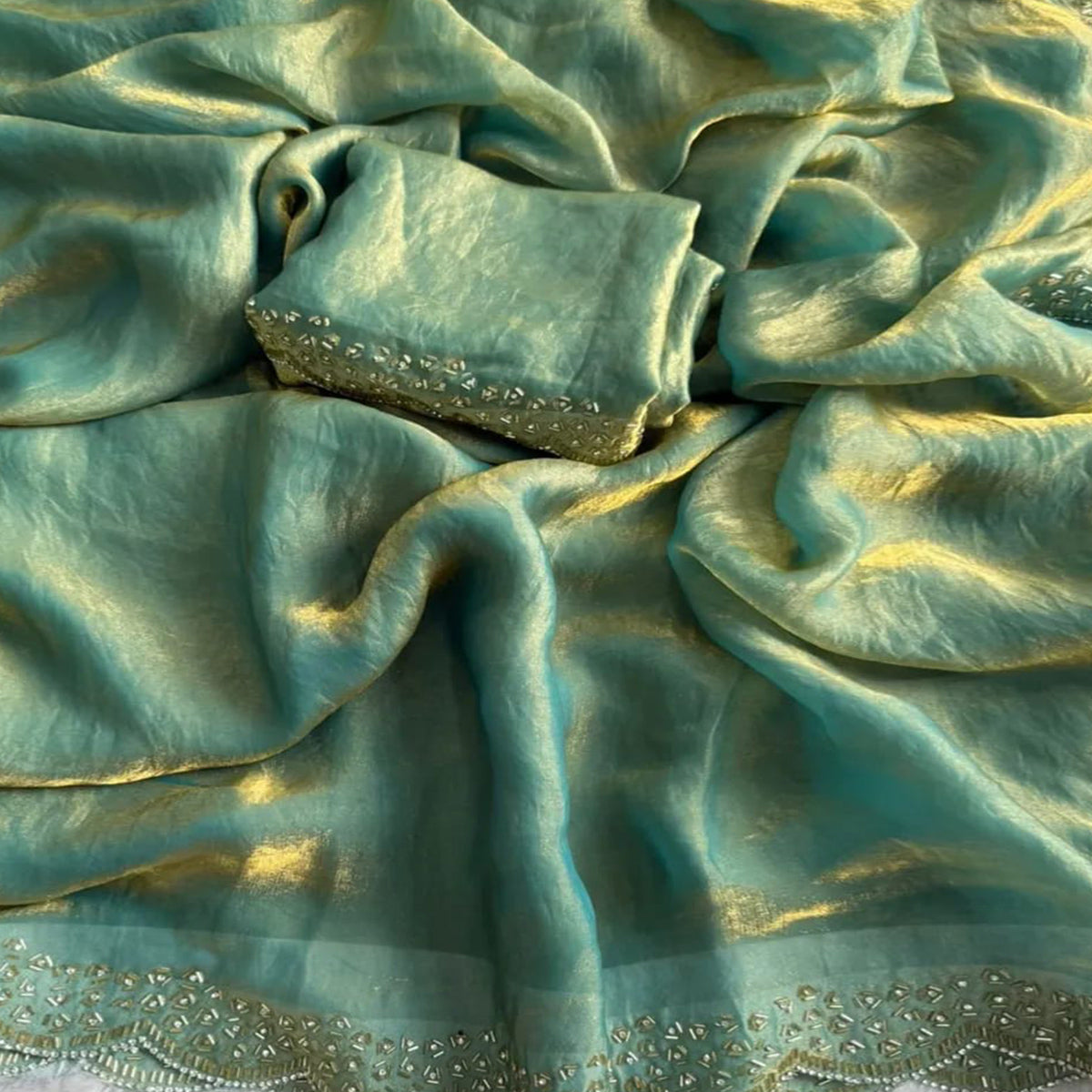 Elegant Sea Green Satin Saree Embellished in Gold Shine