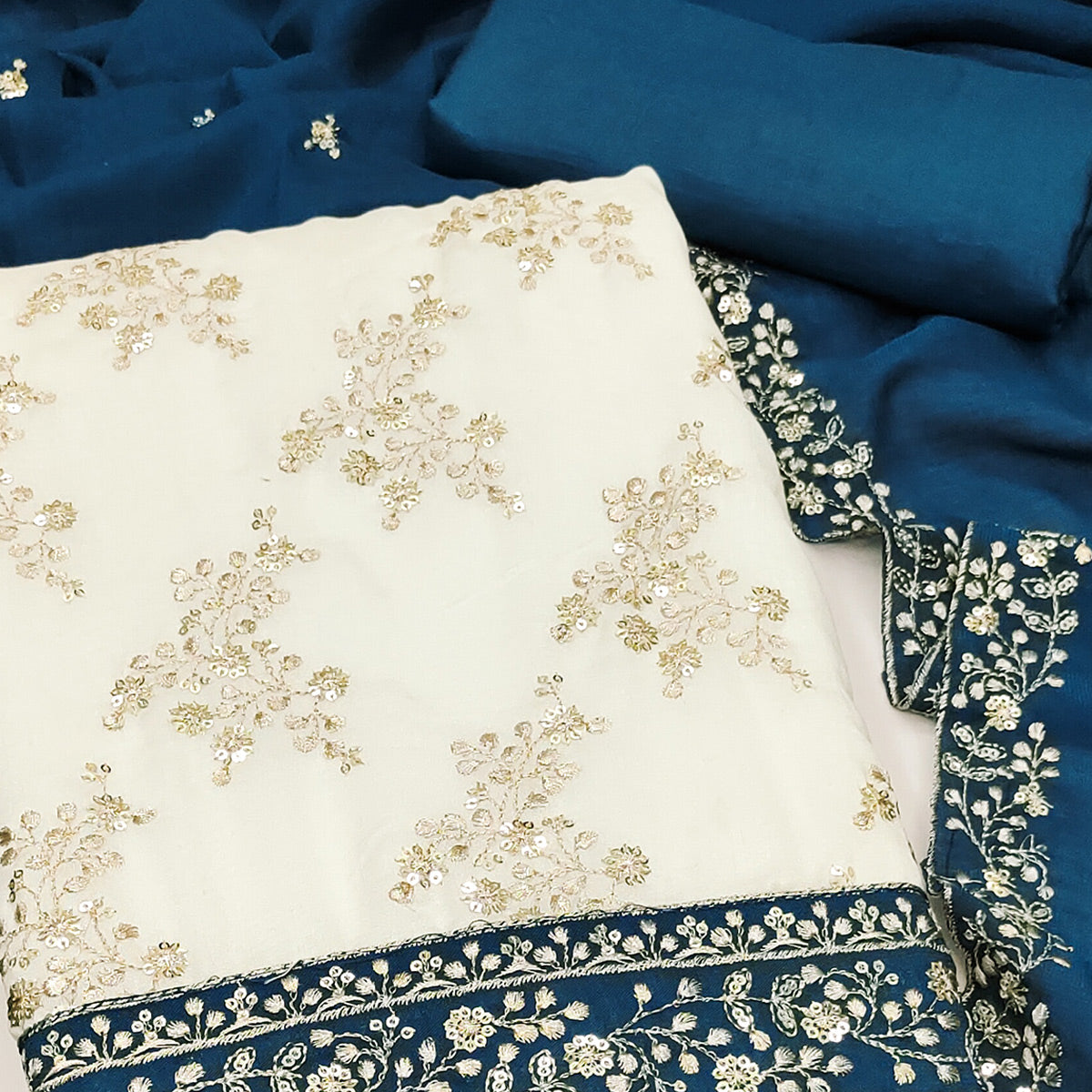 Teal and Off White Vichitra Silk Fabric with Embroidered Detailing
