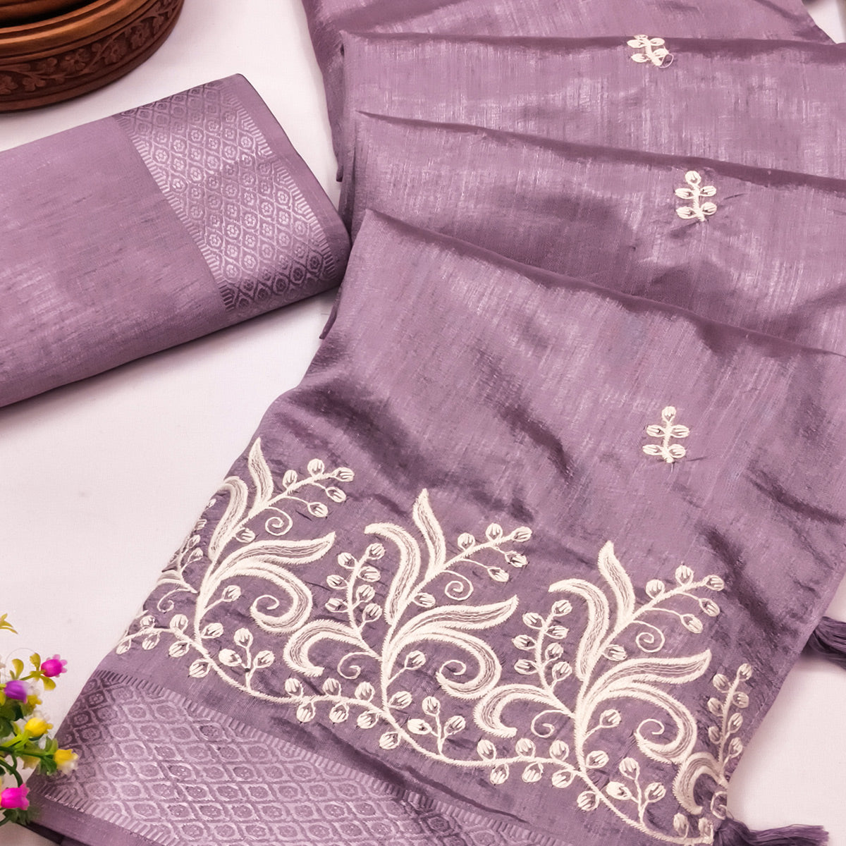 Lavender Art Silk Saree Adorned With Delicate Floral Embroidery & Stylish Tassel Pallu