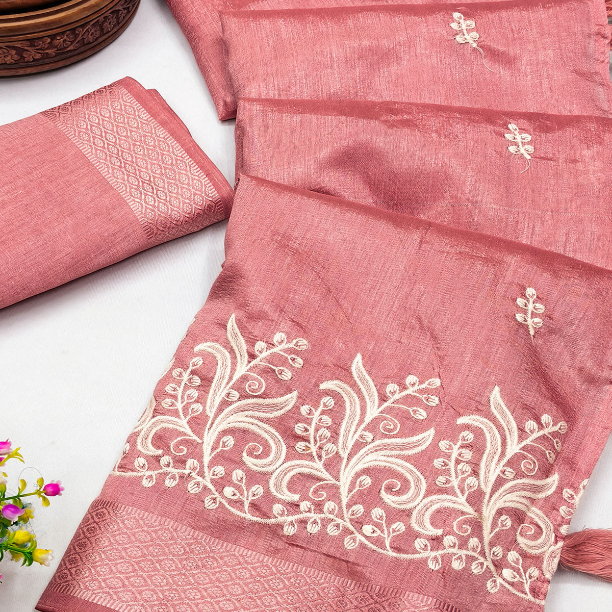 Peach Art Silk Saree Adorned With Delicate Floral Embroidery & Stylish Tassel Pallu