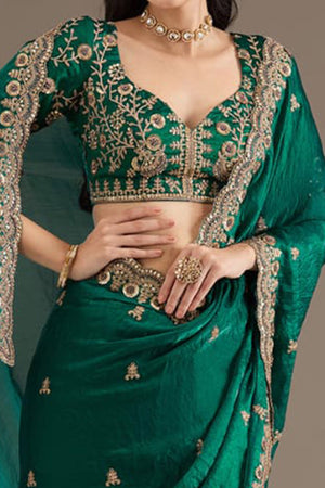 Trendy Green Fancy Satin Saree Enhanced With Rich Golden Embroidered Design