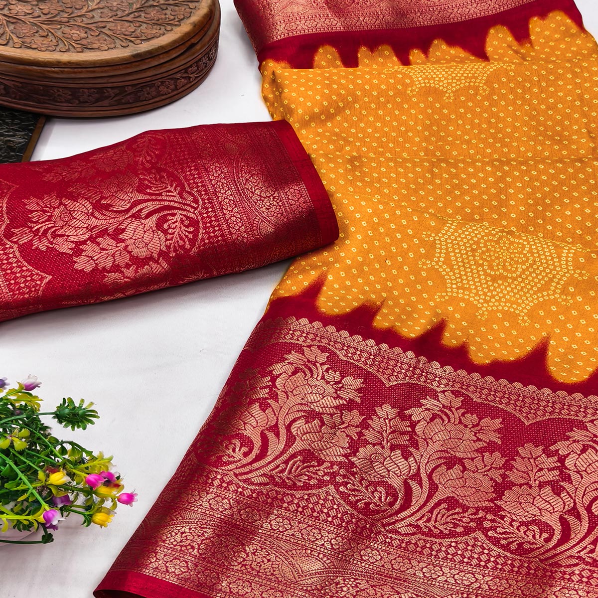Orange Bandhani Printed Dola Silk Saree Adorned With Luxe Floral Weaving Border Work