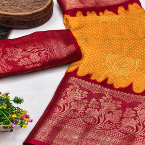 Orange Bandhani Printed Dola Silk Saree Adorned With Luxe Floral Weaving Border Work