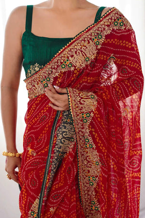 Classic Red Bandhani Print Georgette Saree Enhanced With Intricate Zari Embroidered Border Detailing
