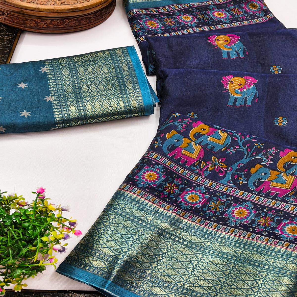 Majestic Navy Blue Elephant & Floral Printed Dola Silk Saree Featuring Intricate Weaving Border