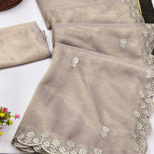 Beige Net Partywear Saree Featuring Fine Floral Embroidery and a Soft, Flowing Look