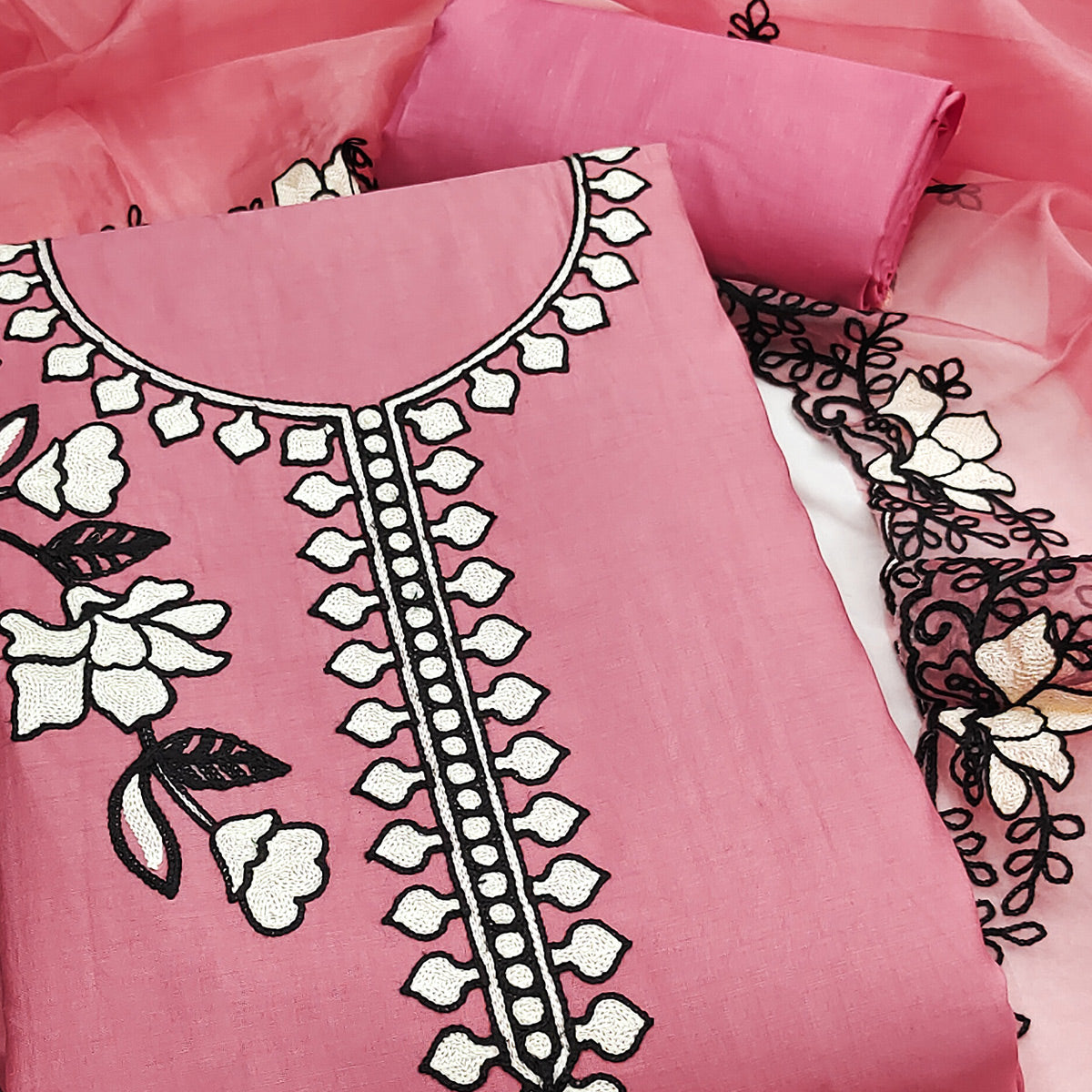 Graceful Gajari Pink Floral Viscose Dress Material Enhanced With Intricate Thread Embroidery Work