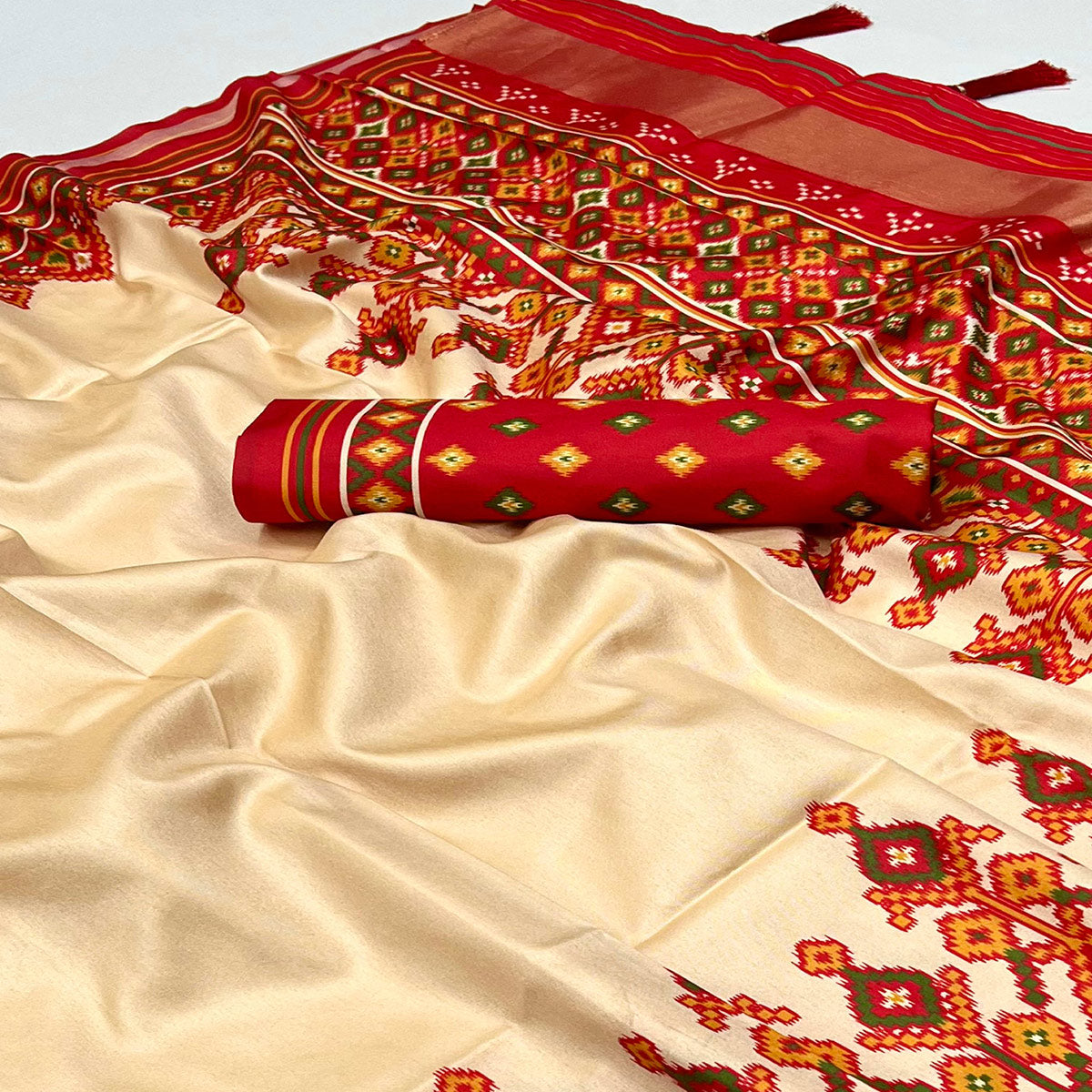 Cream Patola Printed Tussar Silk Saree With Tassels