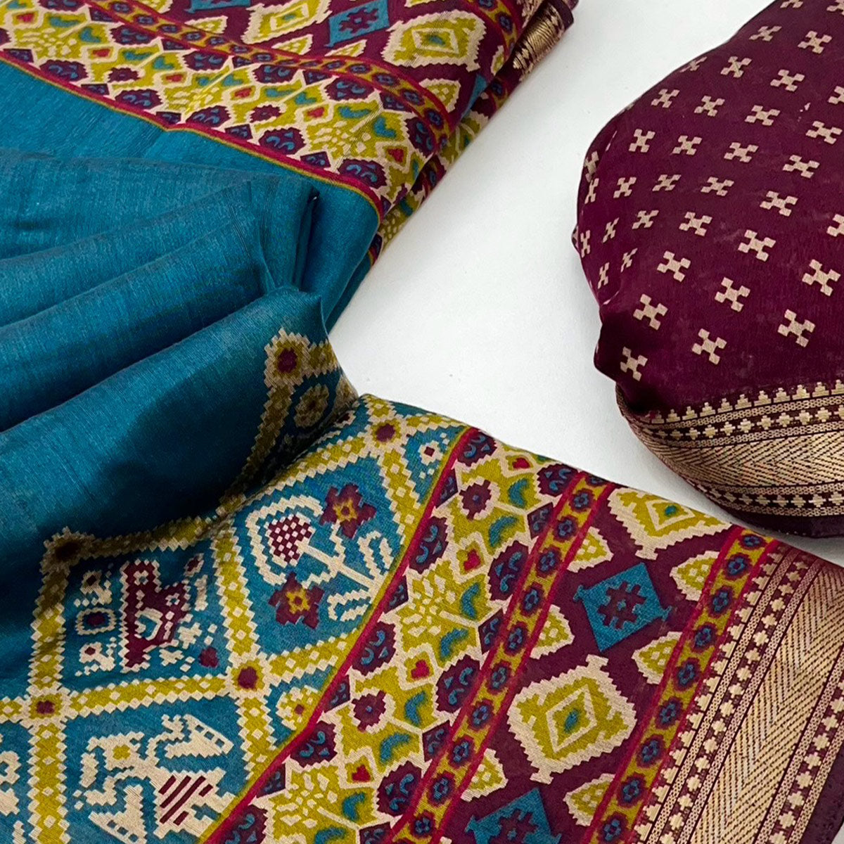 Teal Patola Print Saree in Featherlight Mulmul Cotton with Zari Border