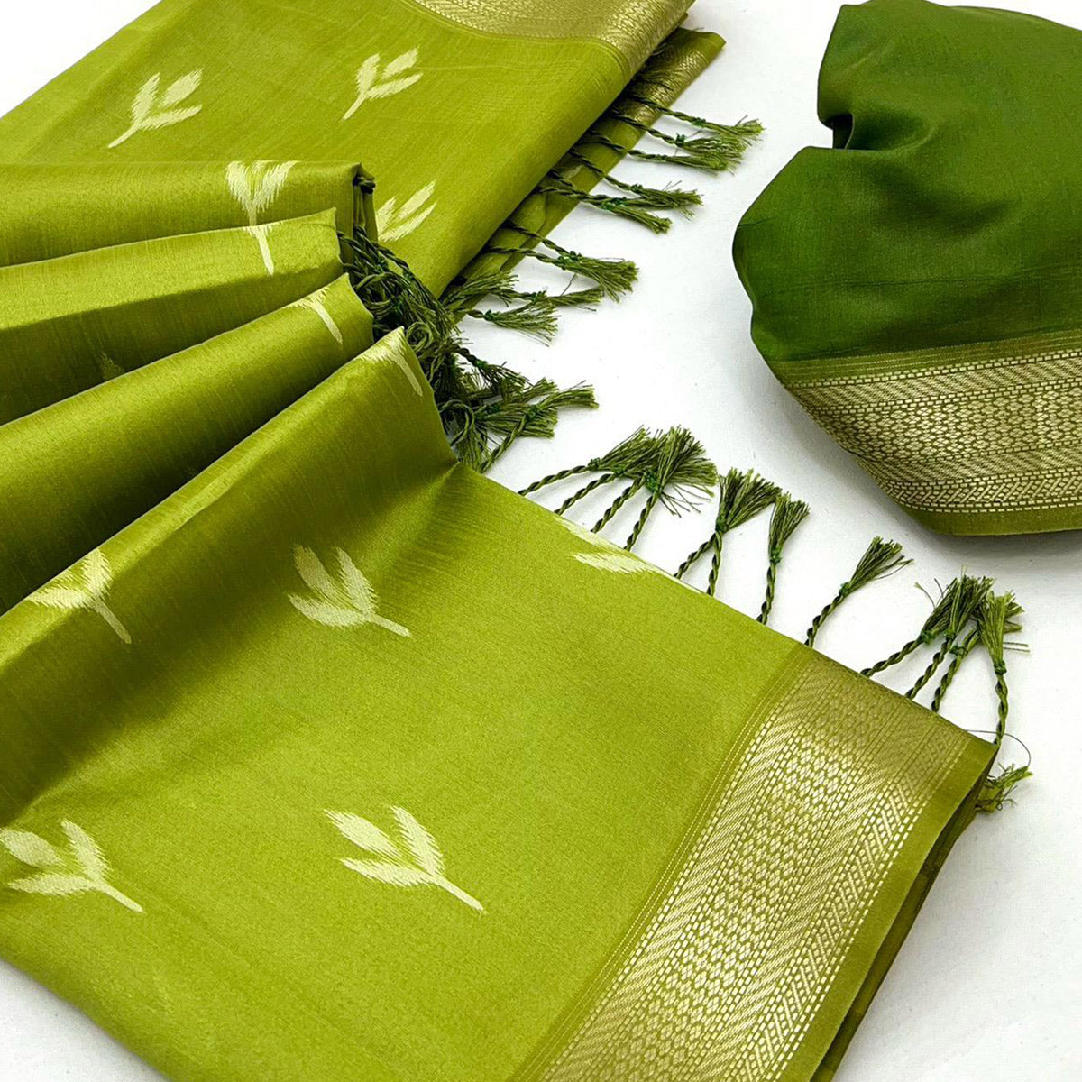 Green Ikkat Style Rayon Silk Saree with Luxurious Zari Border and Delicate Tassels