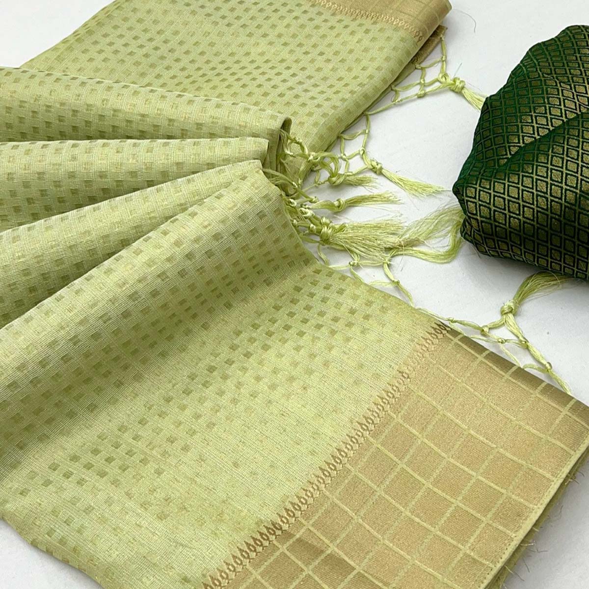 Green Soft Tissue Saree Featuring Rich Zari-Woven Detailing.