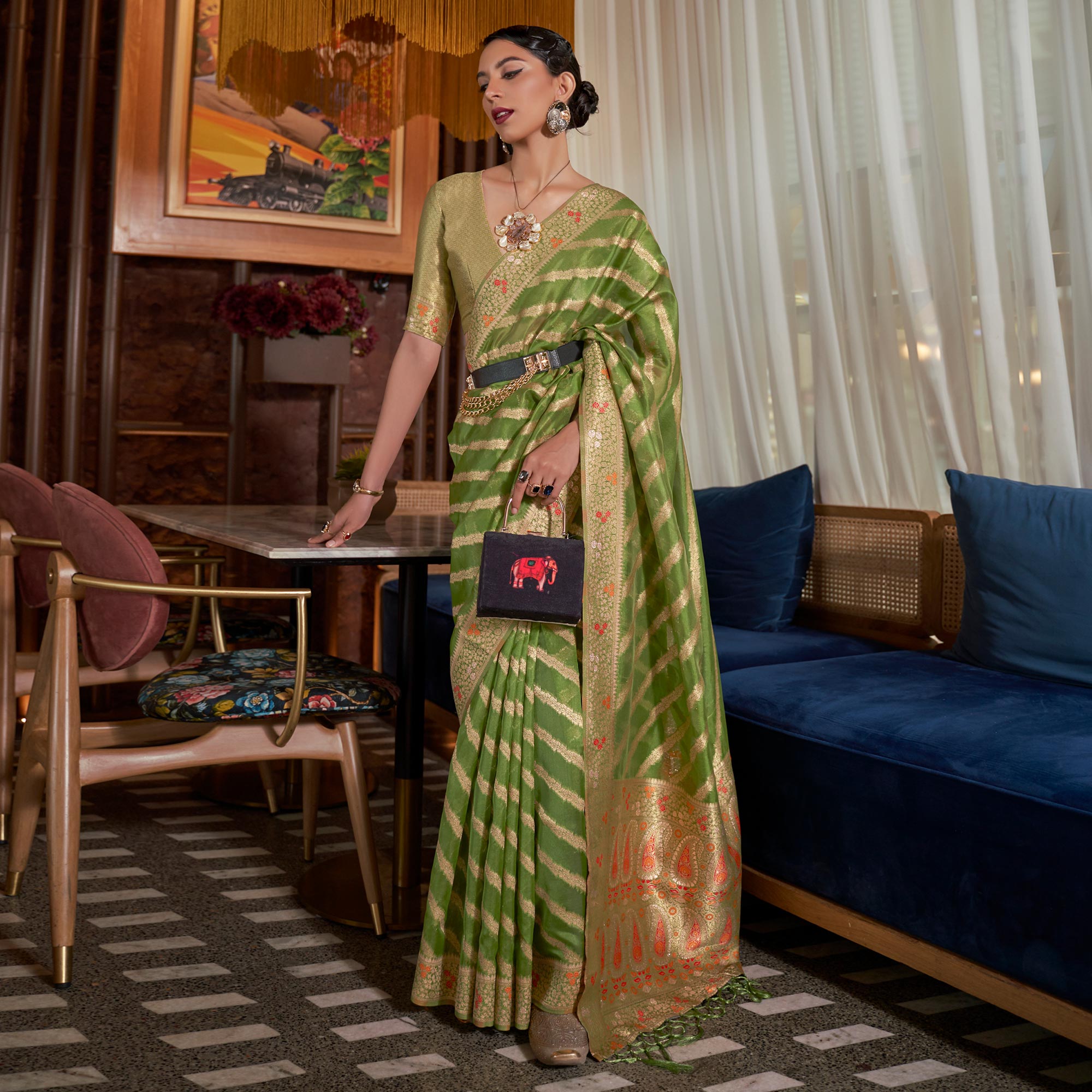 Green Woven Organza Saree With Tassels