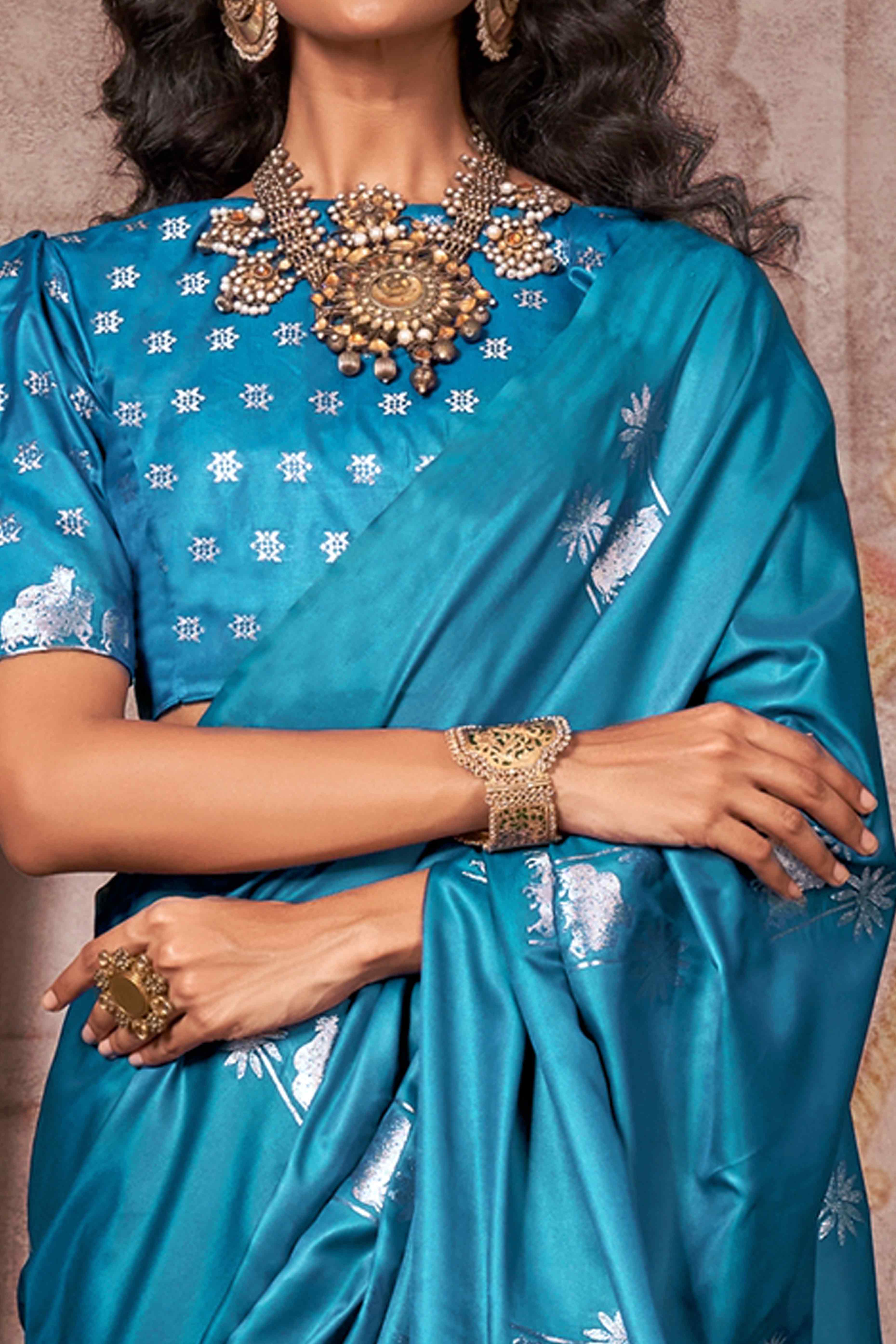 Morpich Blue Satin Silk Saree with Exquisite Floral Zari Weaving & Graceful Tassel Detailing
