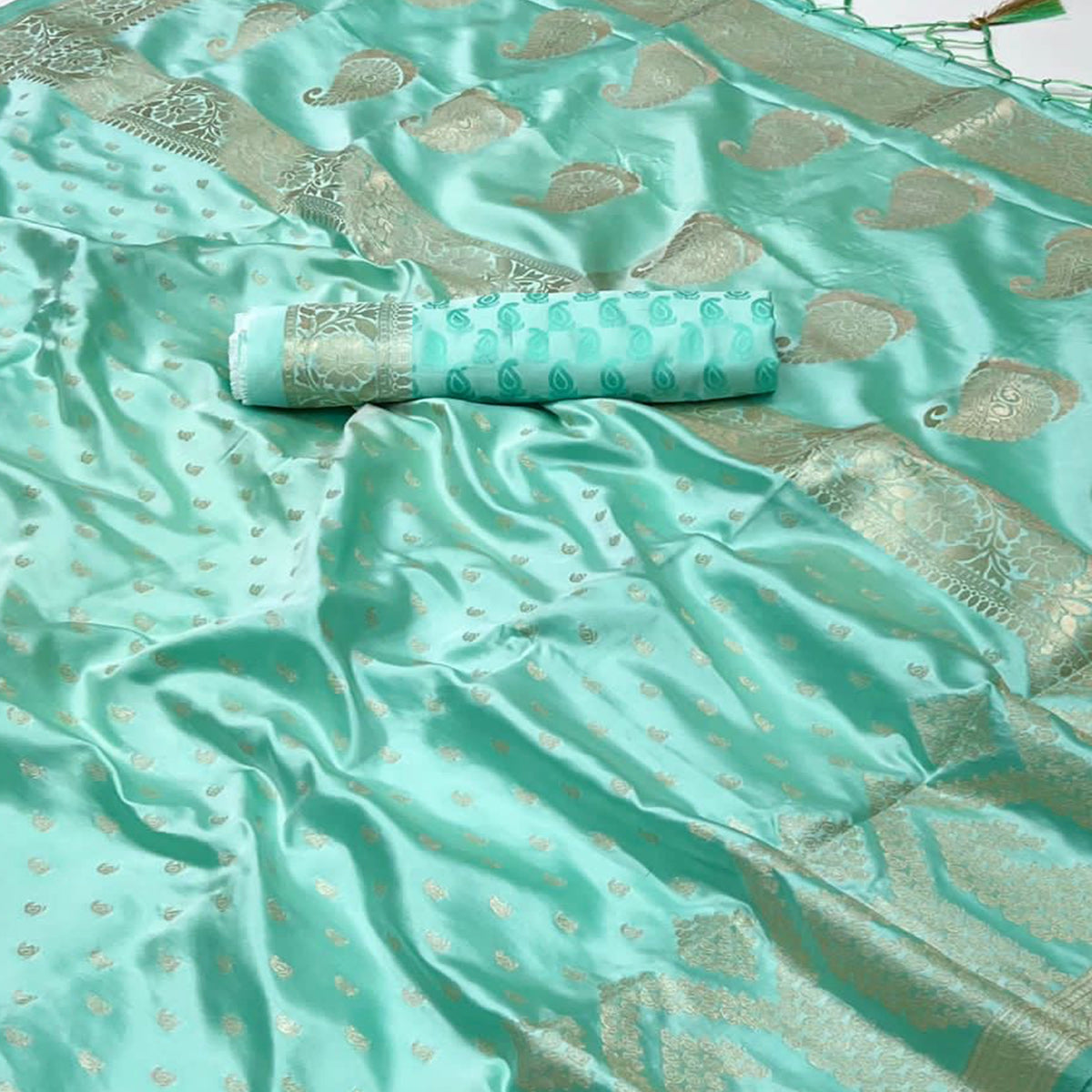 Sea Green Woven Satin Saree With Tassels