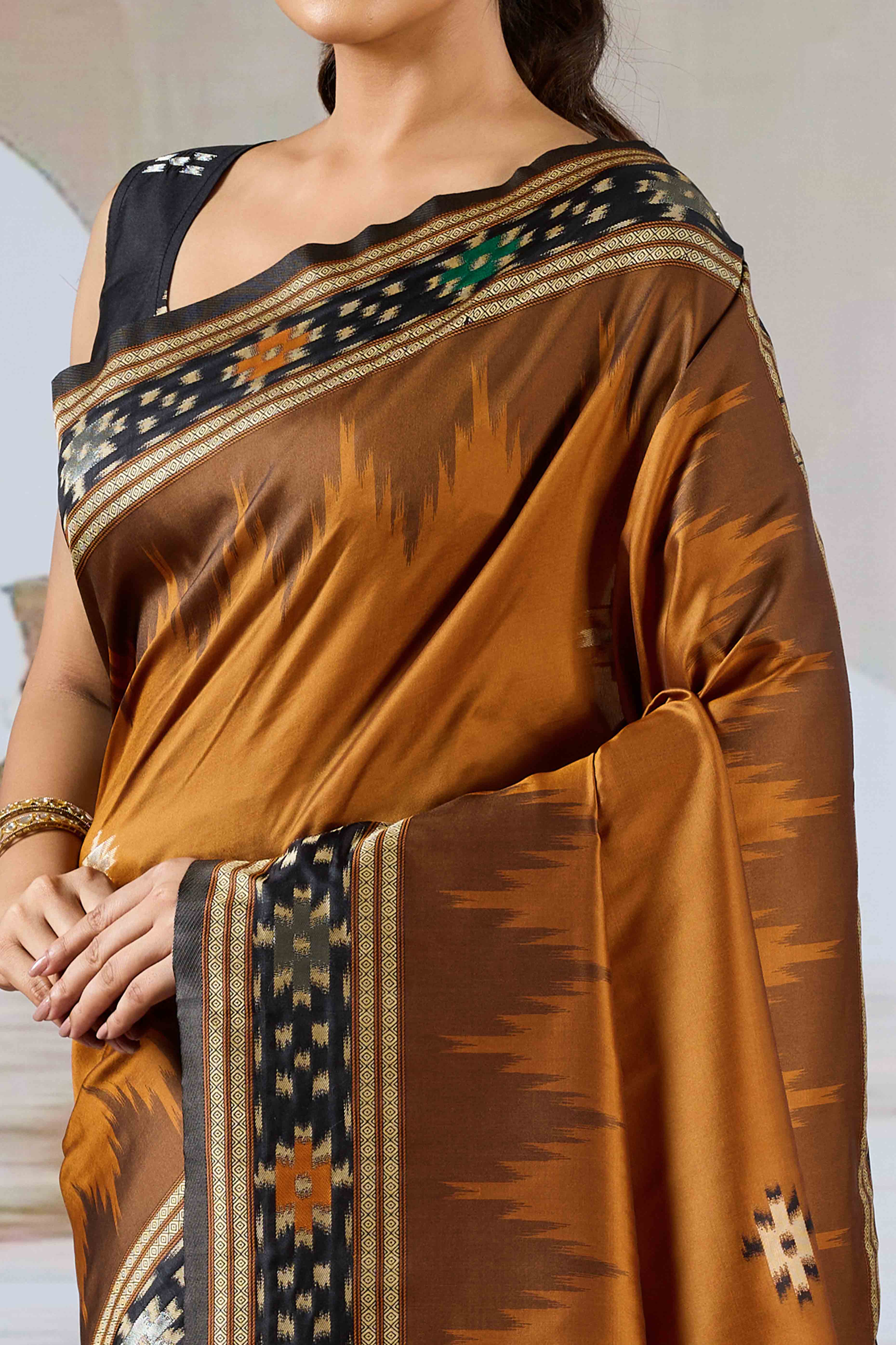 Brown Art Silk Saree Adorned with Intricate Patola Style Woven Designs