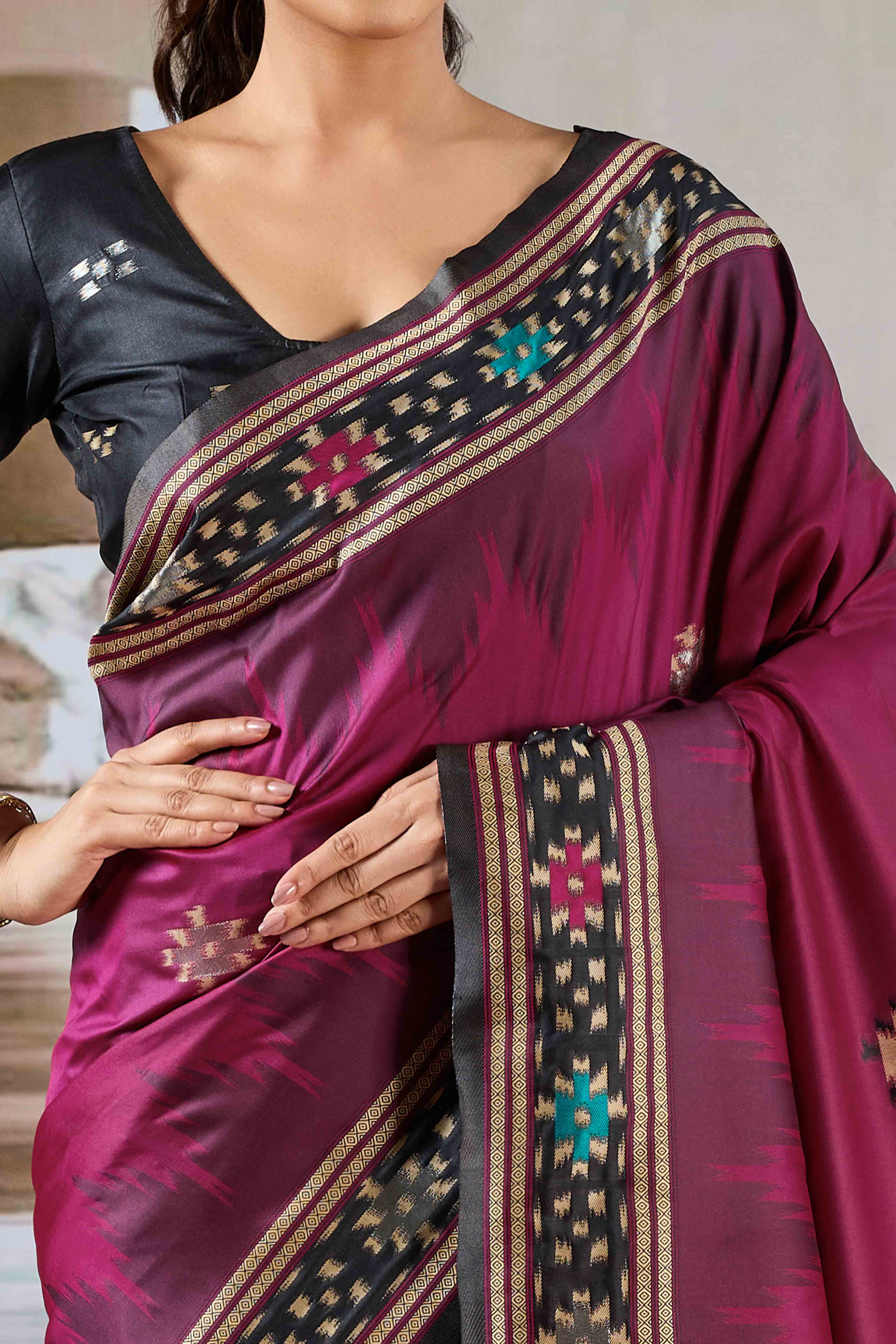Magenta Art Silk Saree Adorned with Intricate Patola Style Woven Designs