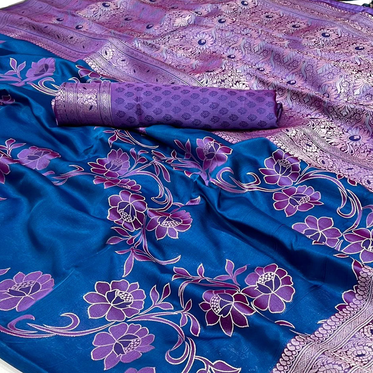 Blue Floral Woven Satin Saree With Tassels