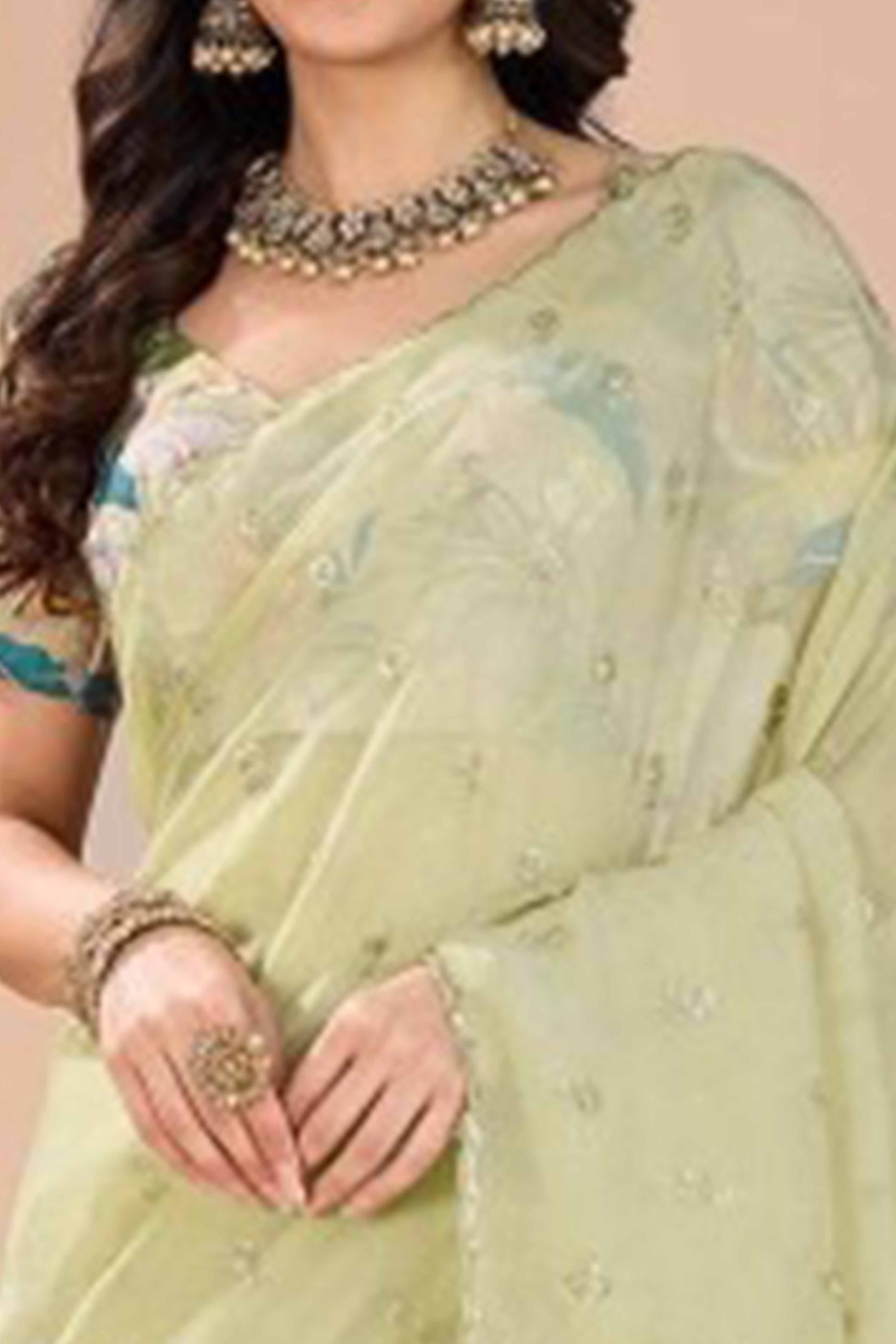 Green Crunchy Saree Adorned With Floral Sequins Embroidery & Graceful Border Finish