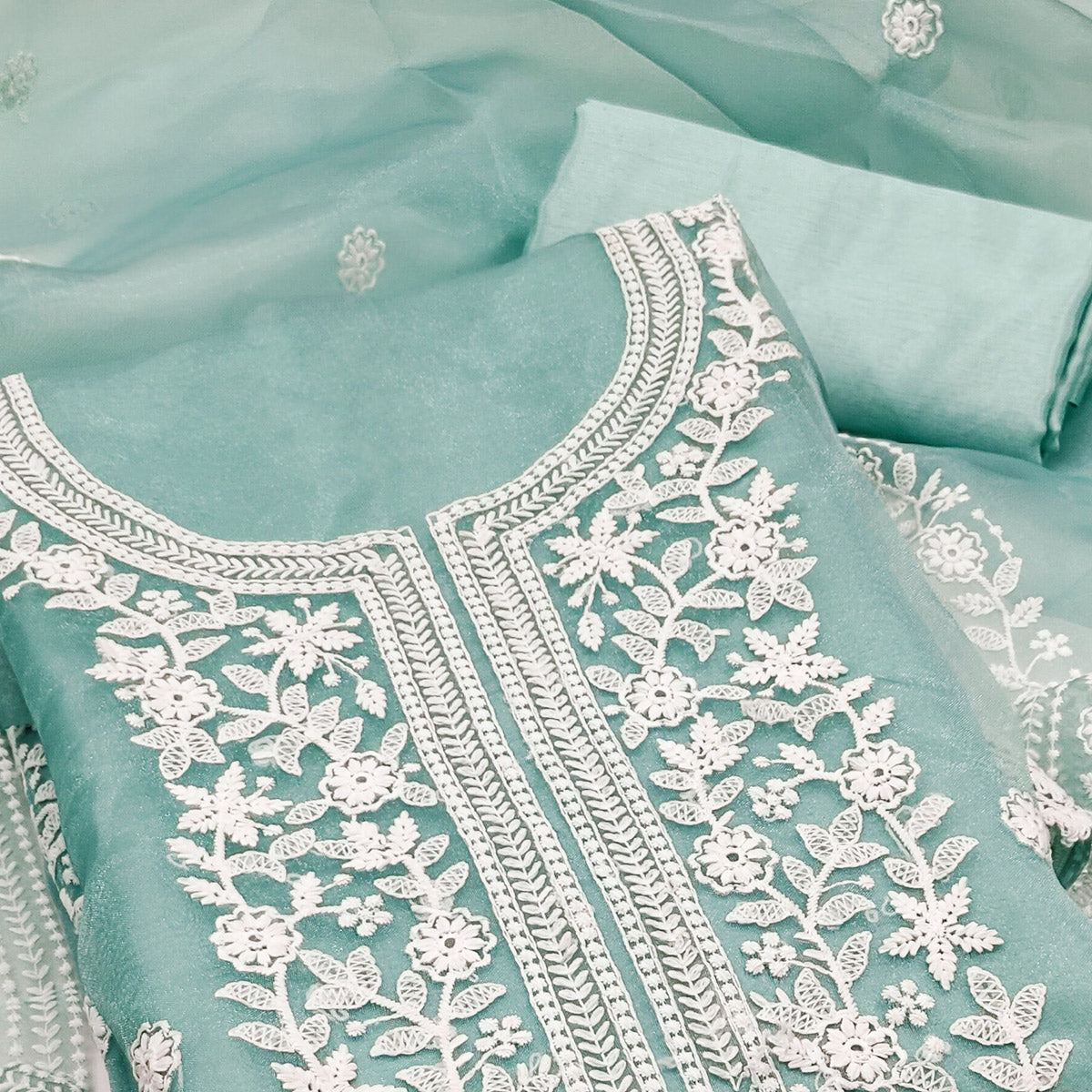 Unleash Your Style With This Turquoise Floral Thread Embroidered Organza Dress Material