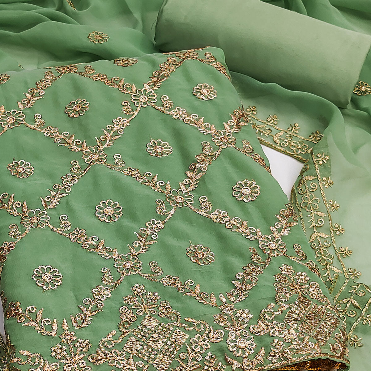 Green Georgette Dress Material Adorned With Floral Zari Embroidery Work