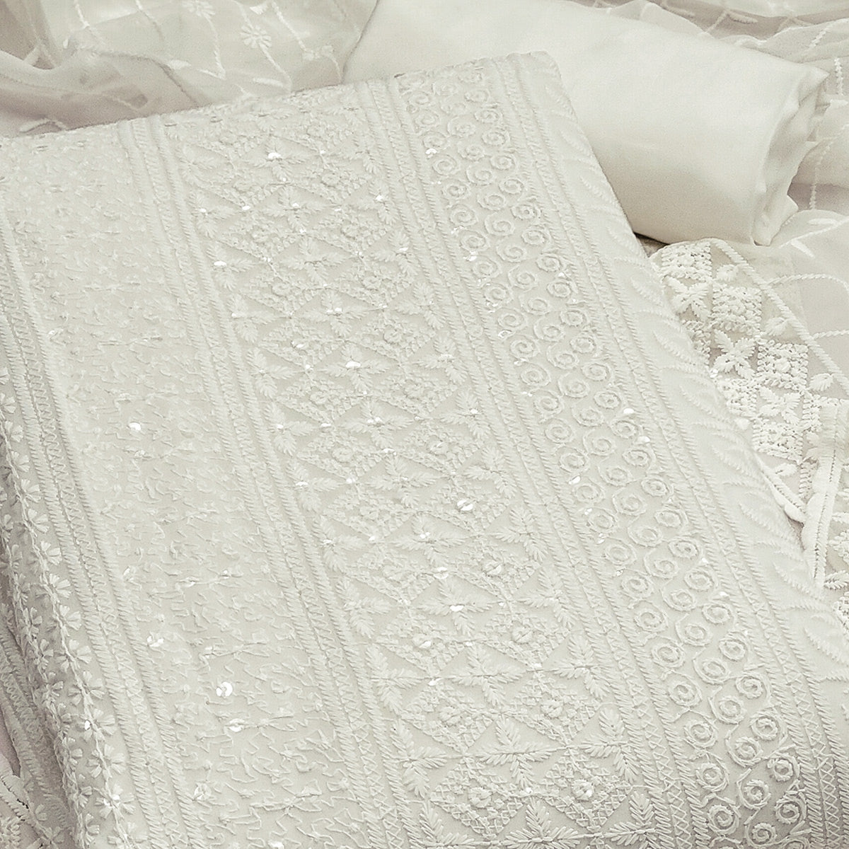 White Floral Thread Embroidery With Sequins Highlighted Georgette Dress Material