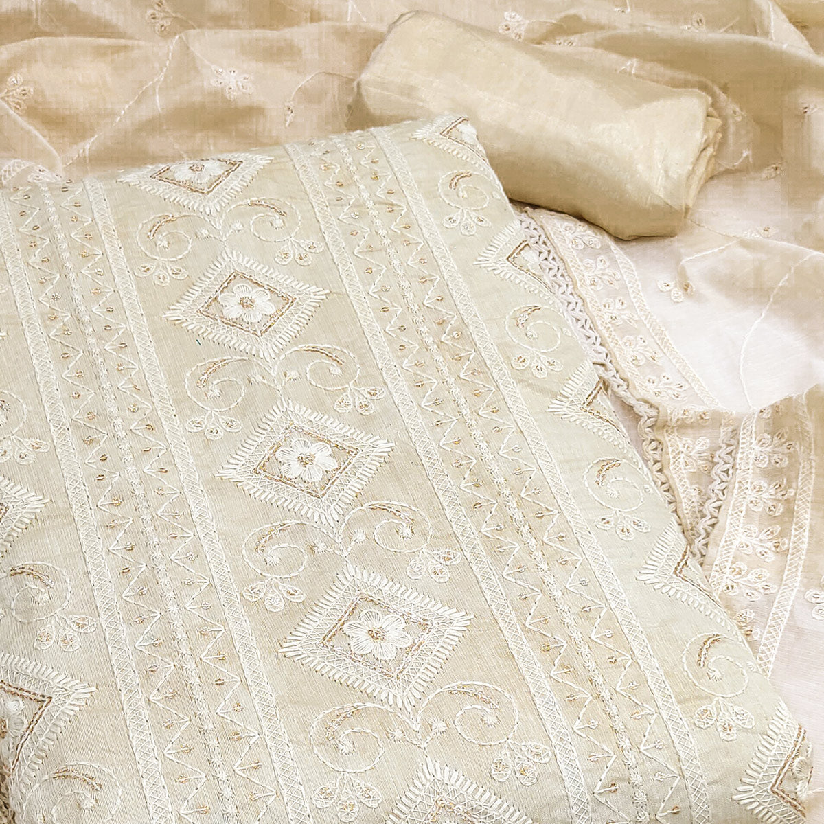 Cream Modal Chanderi Silk Dress Material Adorned With Elegant Floral Lucknowi Embroidery Work