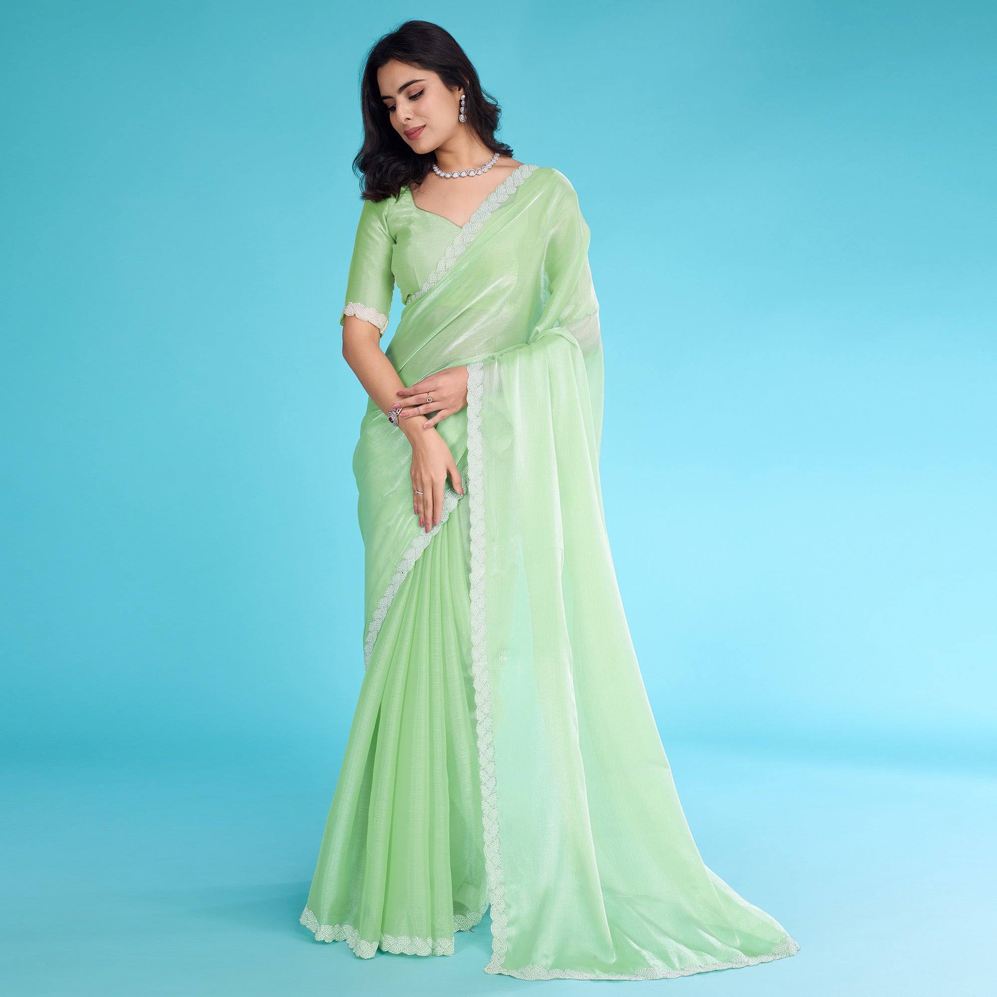 Green Solid With Zarkan & Ceramic Pearl Diamond Lace Tissue Saree