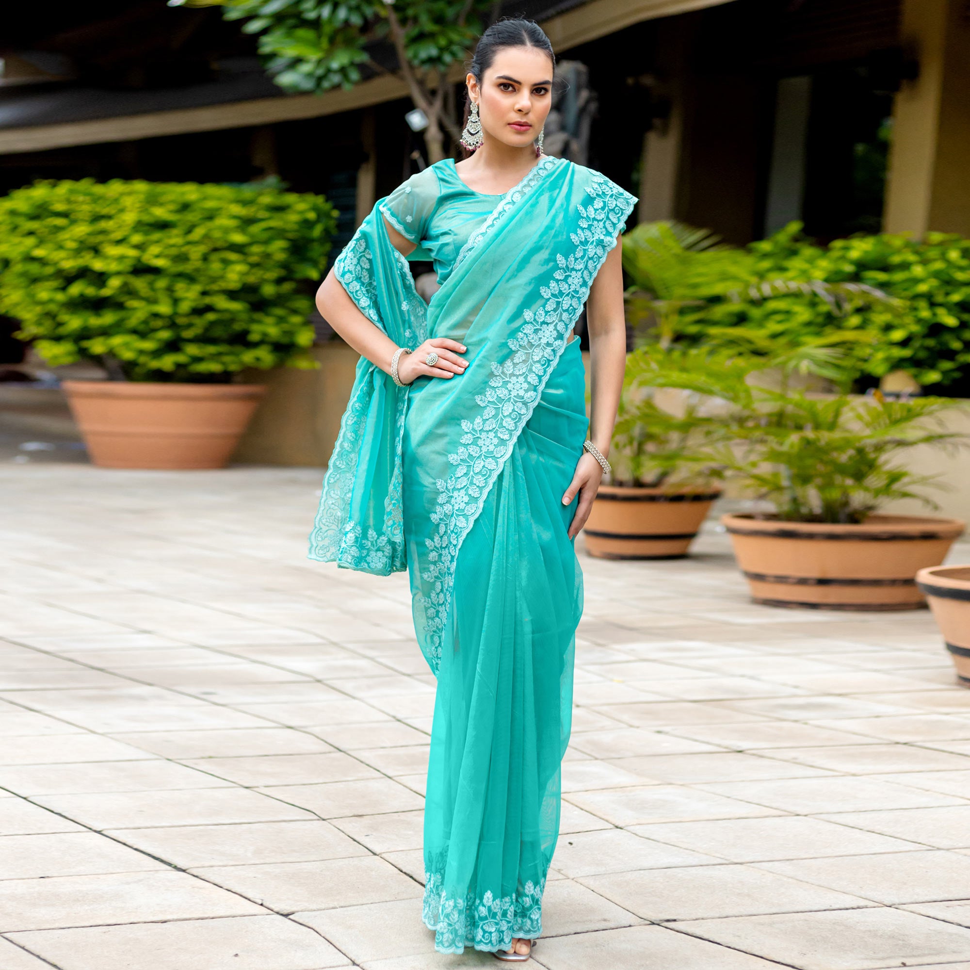 Turquoise Floral Sequins Embroidered Twill Net Saree