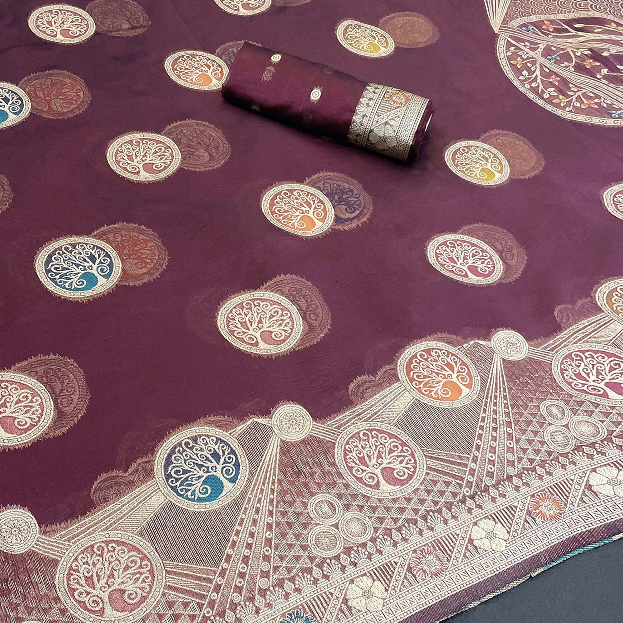 Charming Wine Zari Woven Floral Organza Saree Accented With Digital Printed Pallu & Latkan