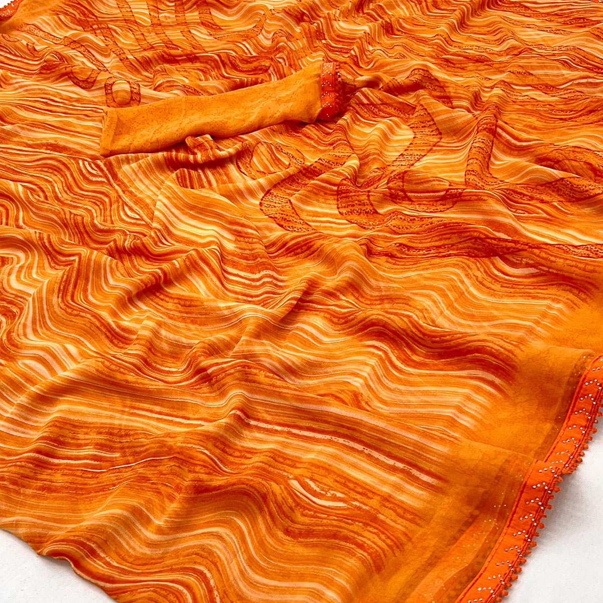 Orange Printed Georgette Saree With Fancy Lace Border