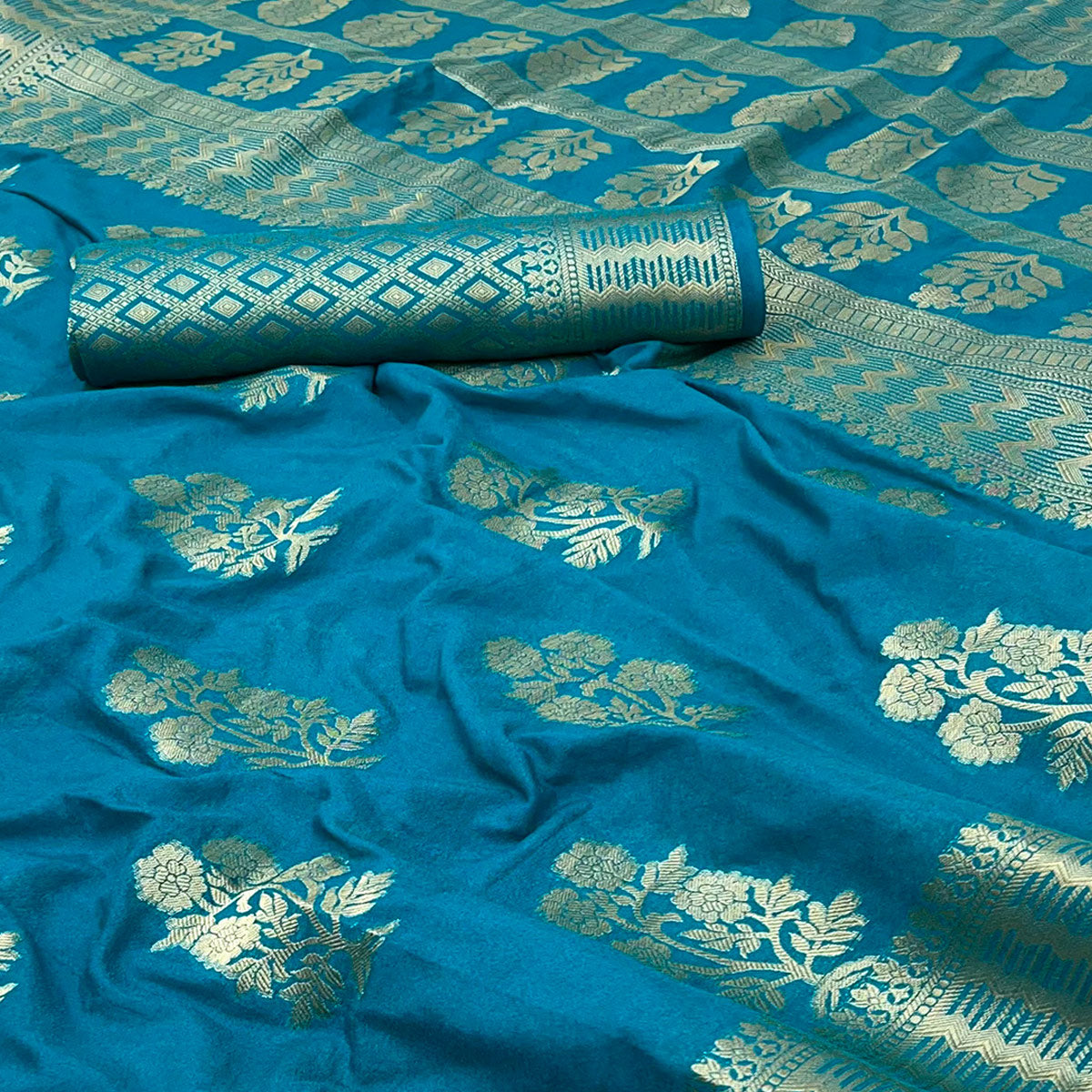 Teal Blue Crepe Silk Saree With Floral Zari Weaving & Stylish Tassel Pallu