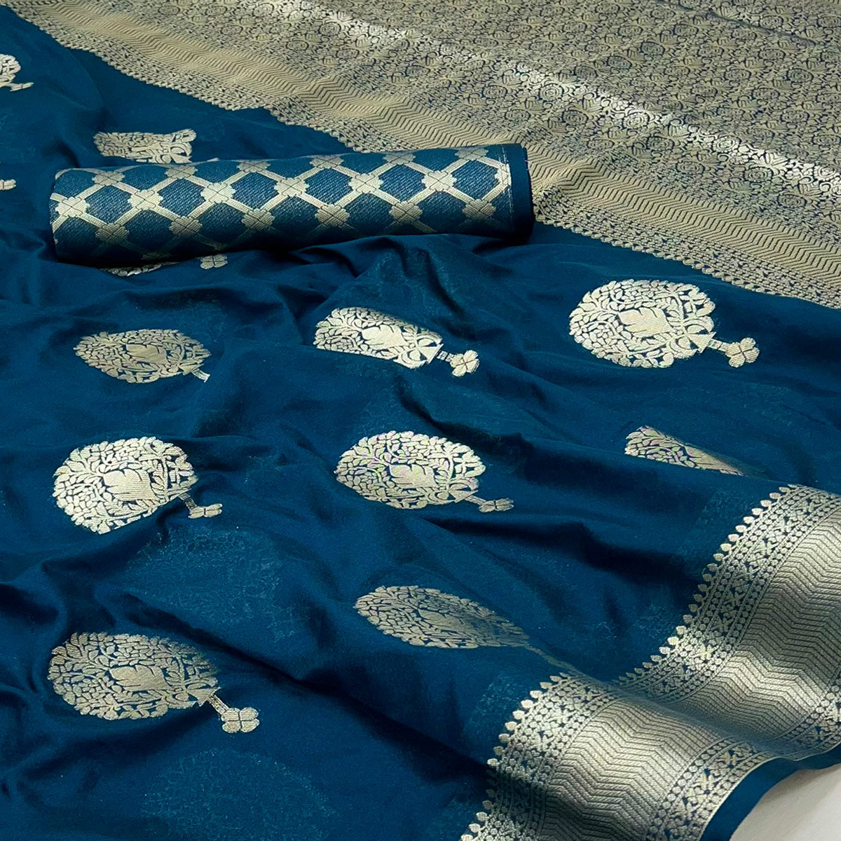 Dark Teal Blue Crepe Silk Saree Featuring Floral Zari Weave & Graceful Tassel Pallu