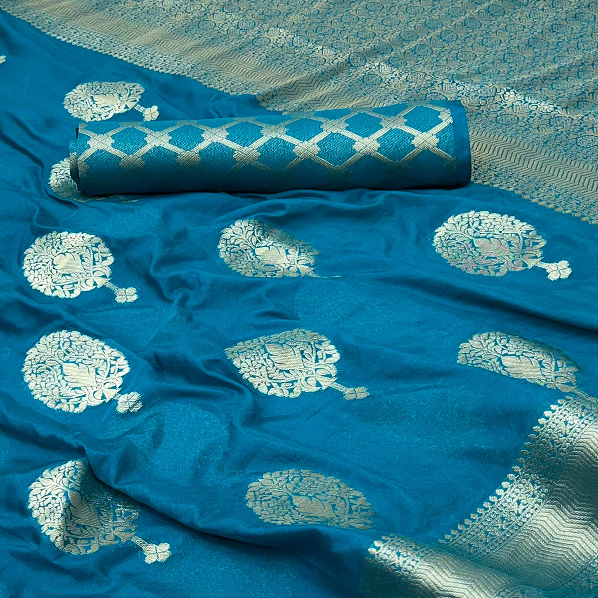 Teal Blue Crepe Silk Saree Featuring Floral Zari Weave & Graceful Tassel Pallu