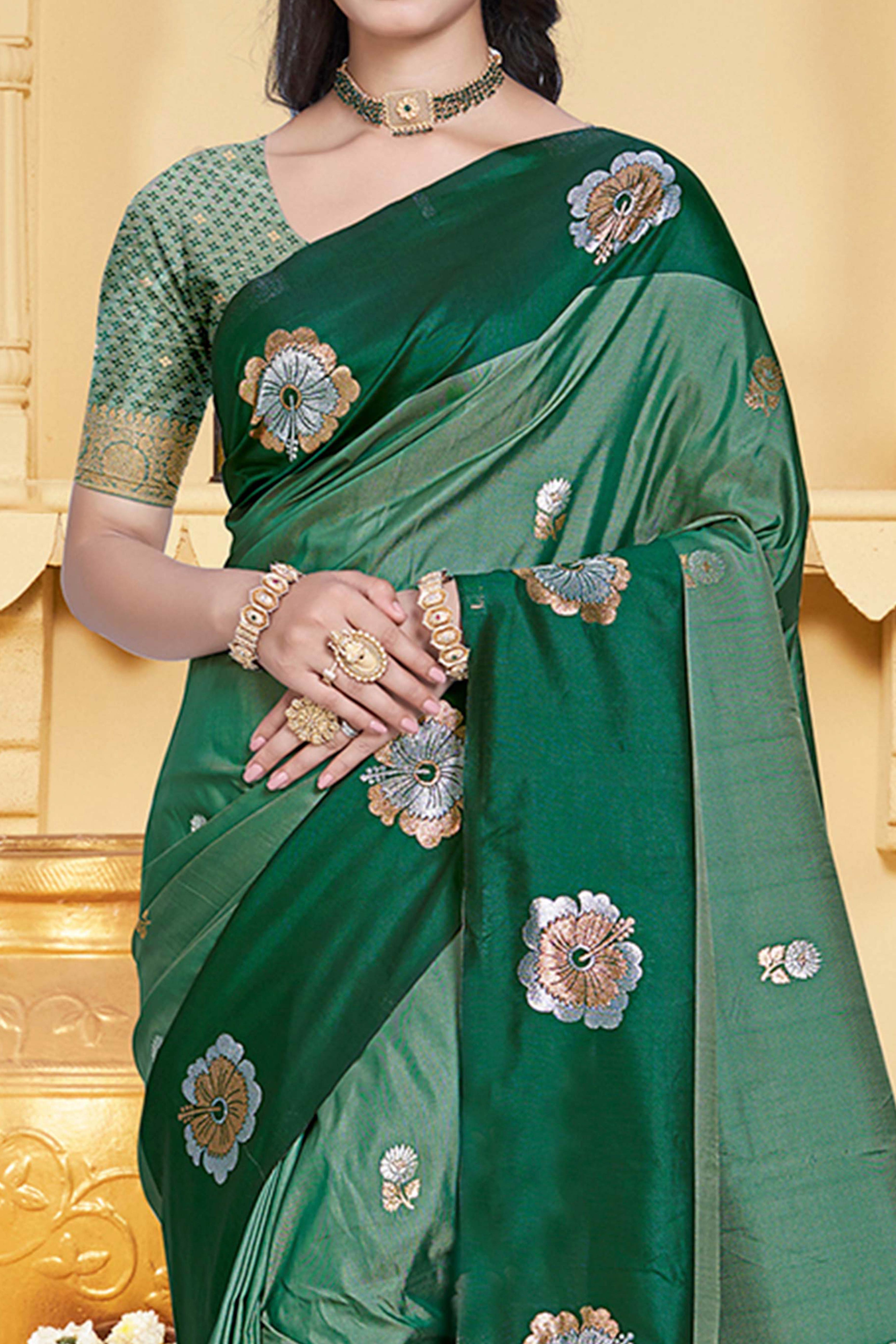 Charming Green Floral Zari Weaving Silk Blend Saree Enhanced With Stylish Tassel Pallu