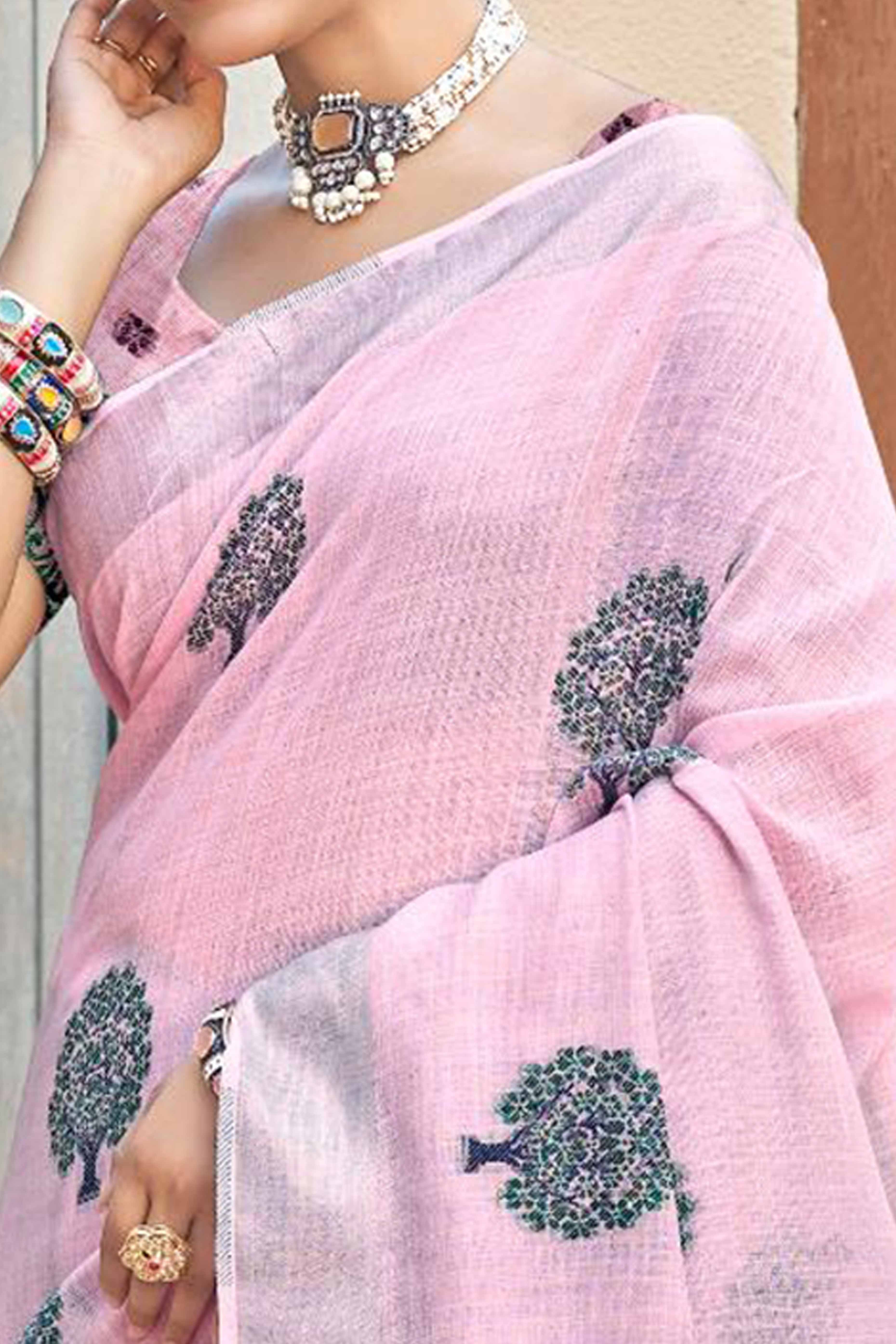 Light Pink Linen Saree Adorned With Intricate Zari Weaving & Tassel Pallu