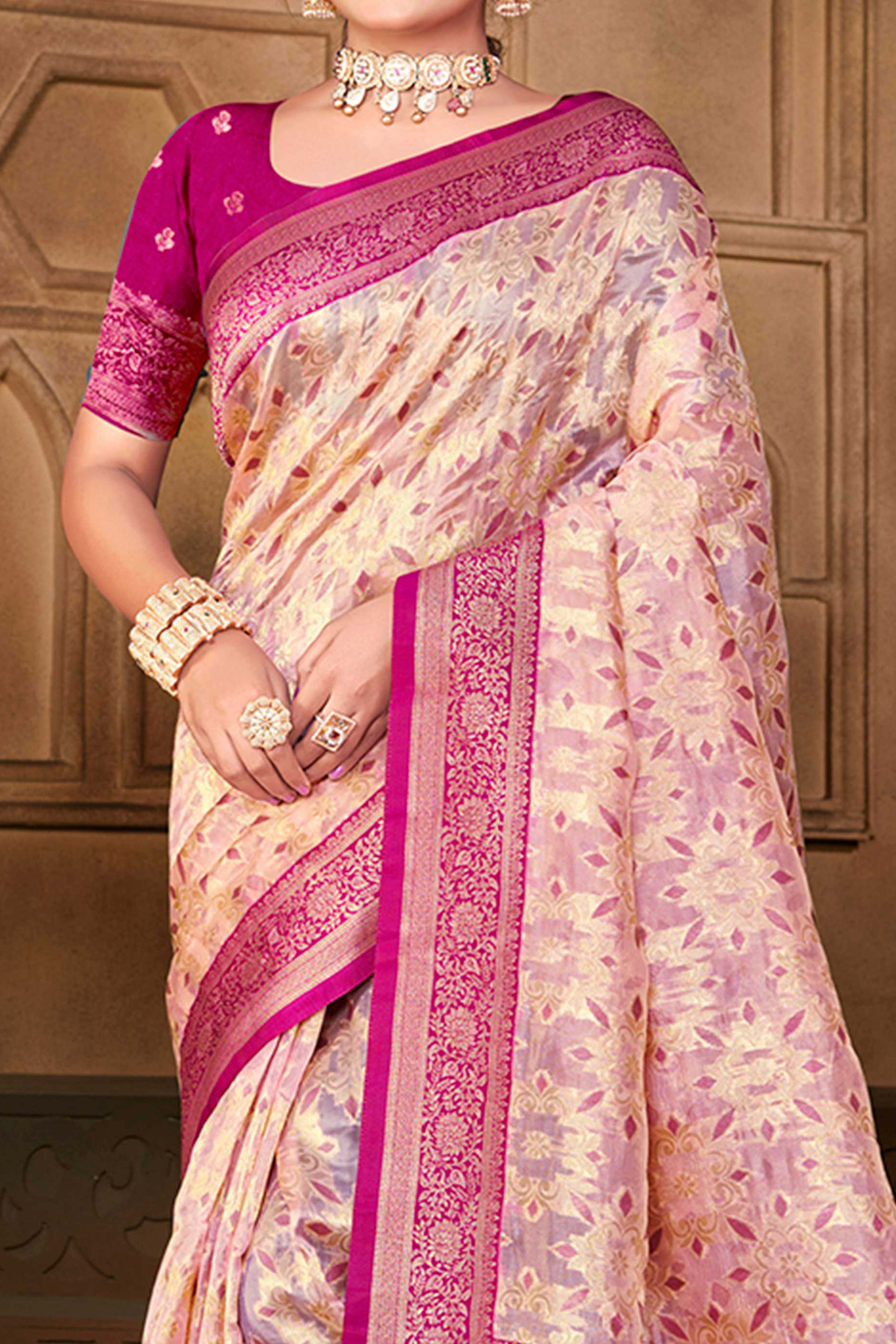 Stunning Pastel Magenta Floral Weaving Silk Blend Saree Enhanced With A Stylish Tassel Pallu