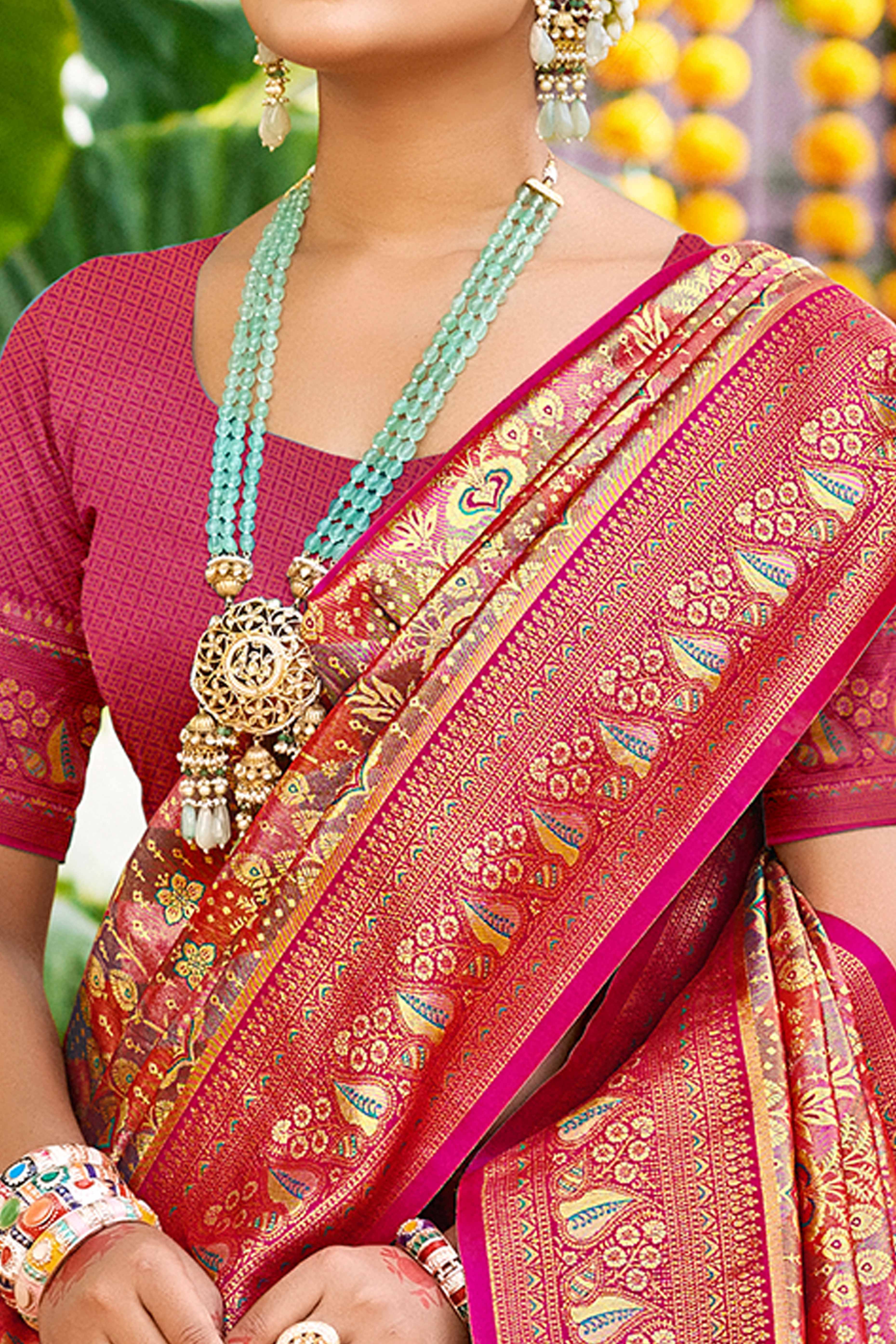 Magenta Floral Weaving Silk Blend Dharmavaram Saree Accented With Tassel Pallu